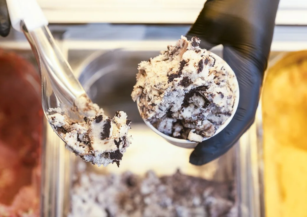 close-up of cookies and cream gelato being served in a gelato cup at Tivoli jean-marie auboine chocolatier store