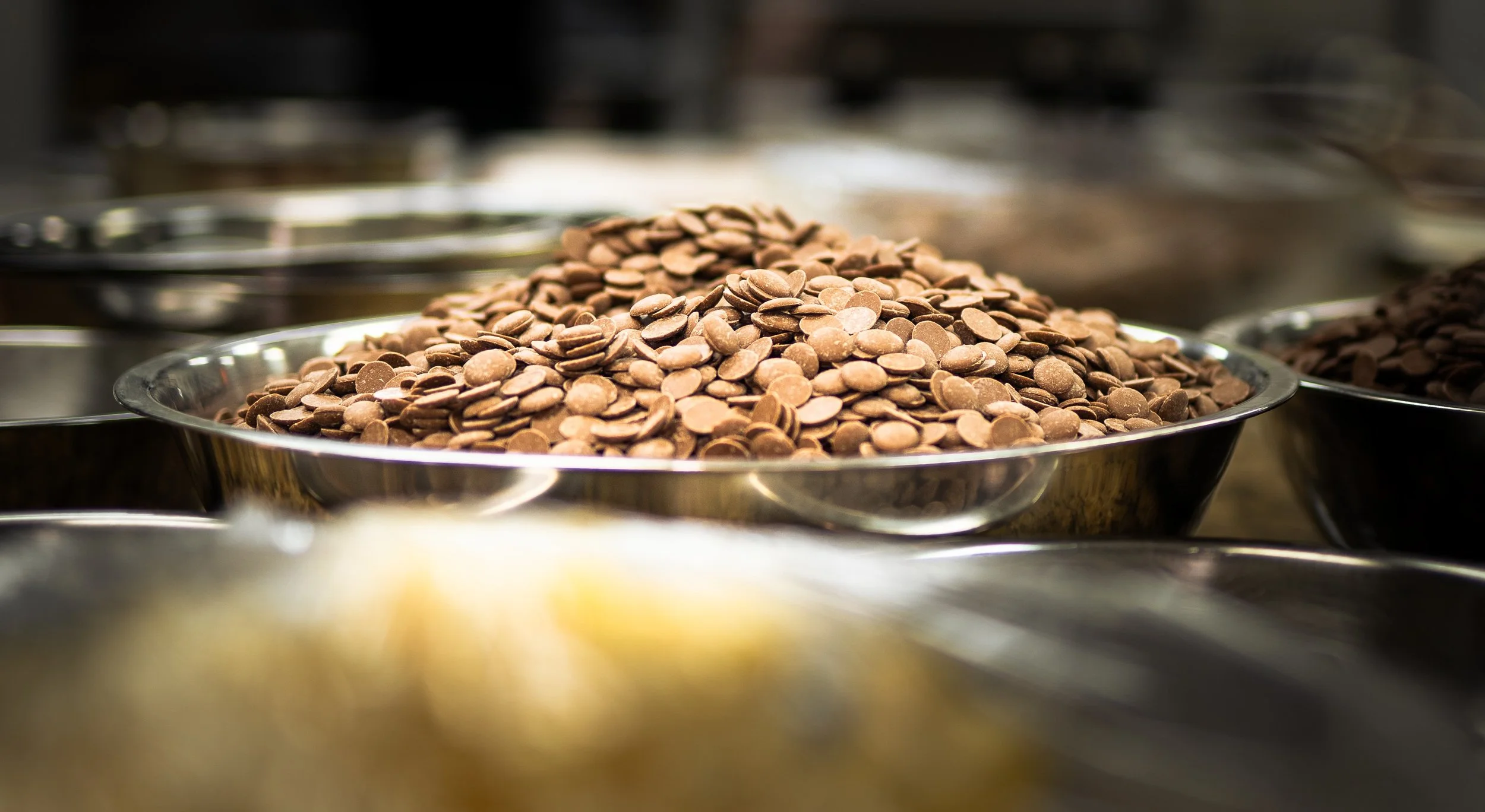 Giant bowl of premium Swiss couverture chocolate in the Jean-Marie Auboine Chocolatier kitchen