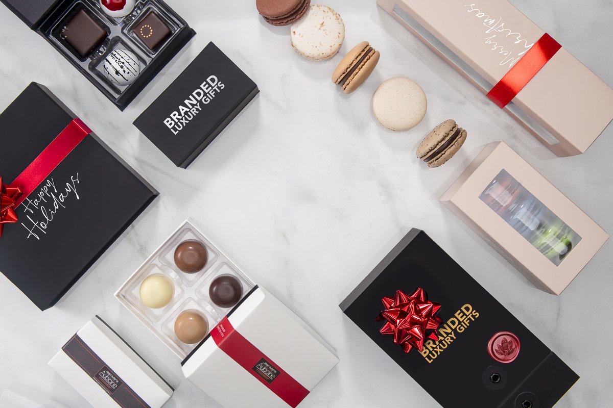 Premium Customizable Branded Boxes by JMA displayed on a marble table