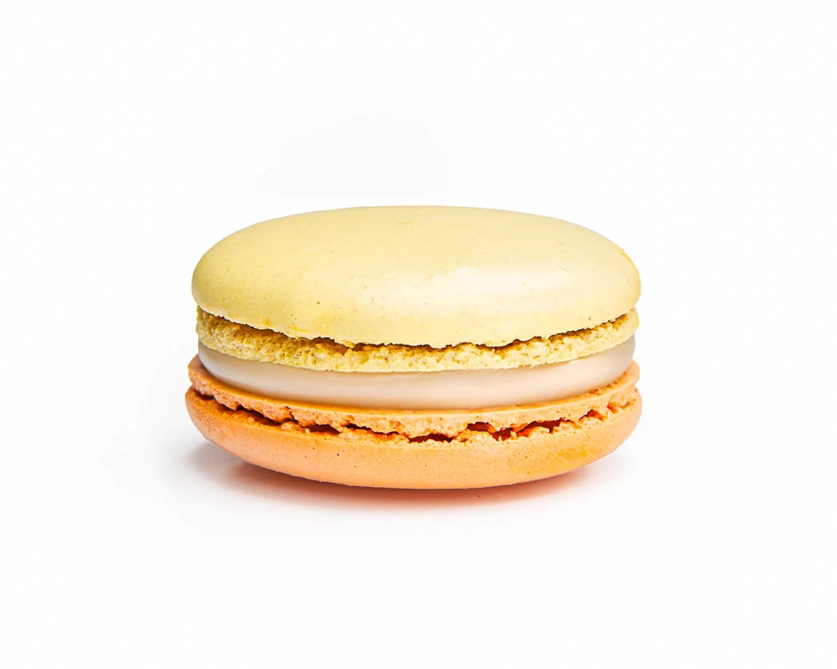 Yuzu French macaron featuring bright citrus flavor inspired by the popular Japanese fruit.