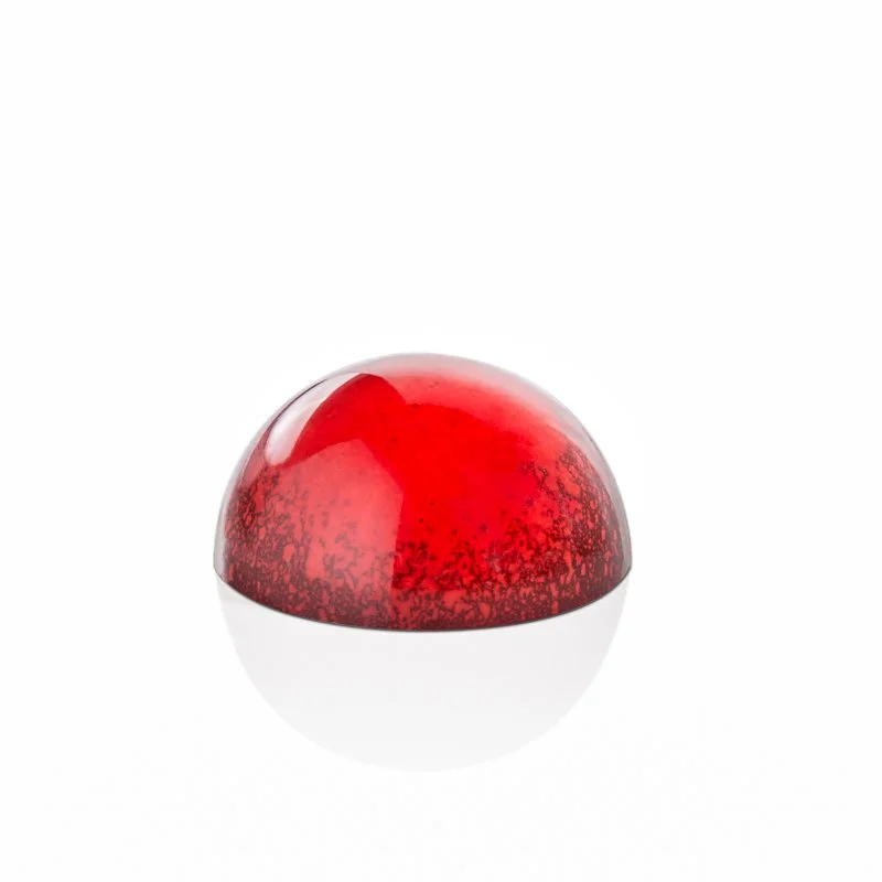Close-up of handcrafted chocolate bonbons with glossy colorful shells