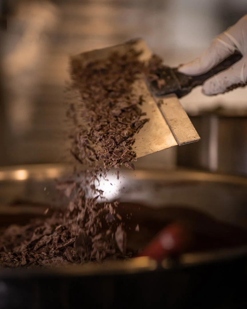 chocolate being tempered at the Jean-Marie Auboine Chocolatier Factory