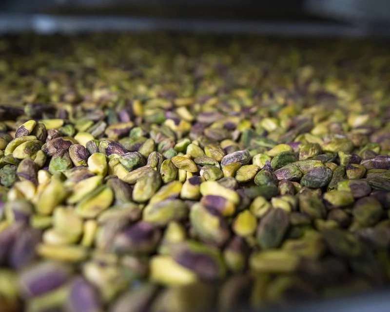 Roasted pistachios used to create house-made pistachio praline and premium confections.