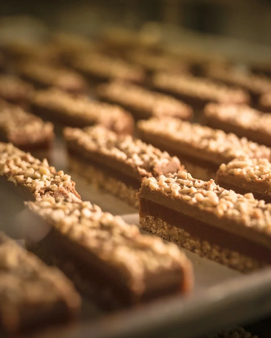 Famous Lion Bar Cut Shot Before Being Enrobed in Premium Milk Chocolate at Jean-Marie Auboine Chocolatier Factory