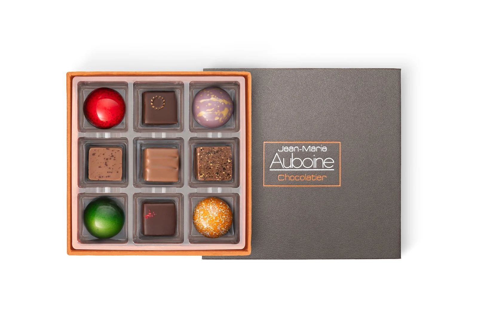 Luxury four-piece assortment chocolate box featuring vibrant artisan bonbons.
