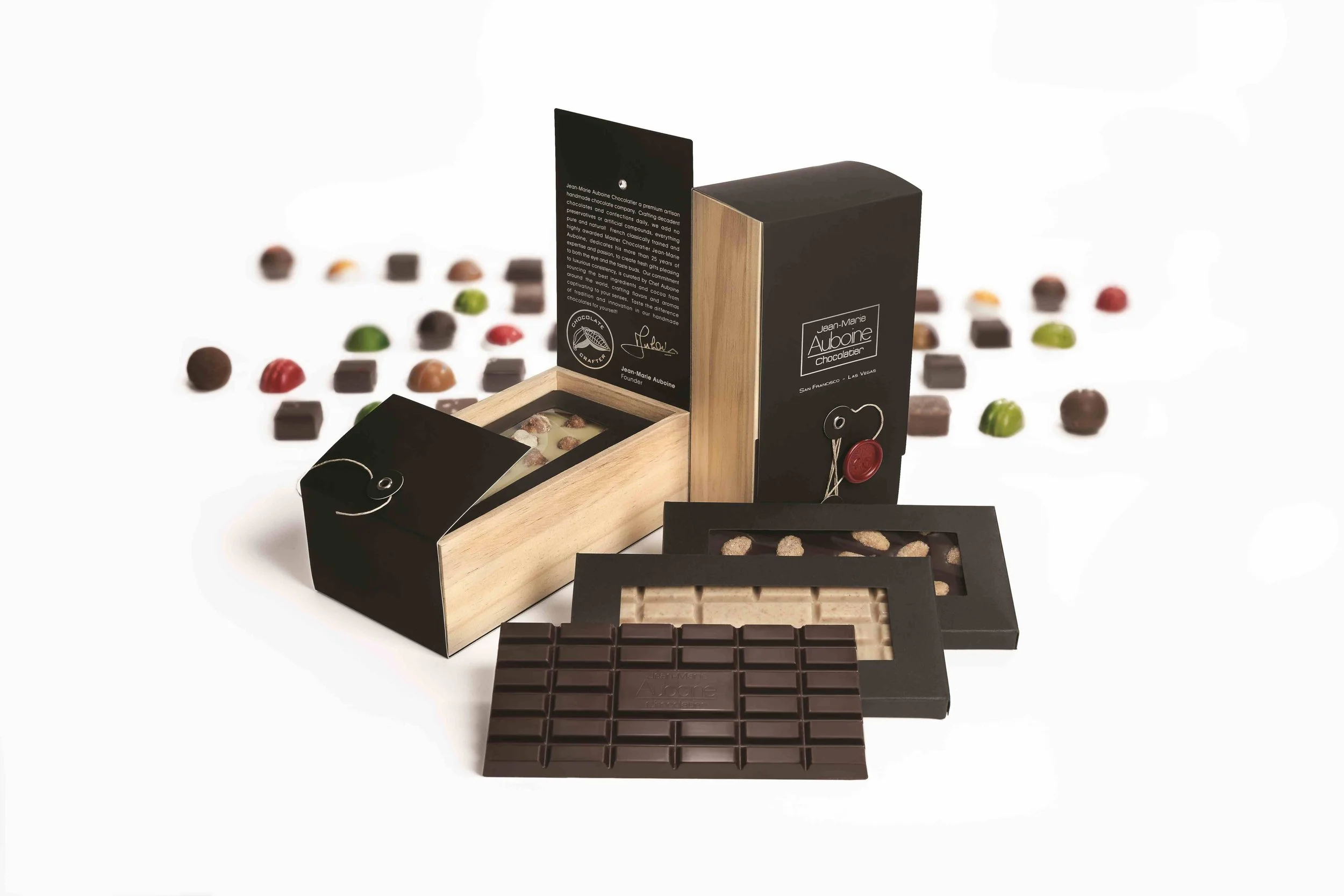 Luxury wooden chocolate gift box filled with premium artisan bonbons and gourmet tasting squares