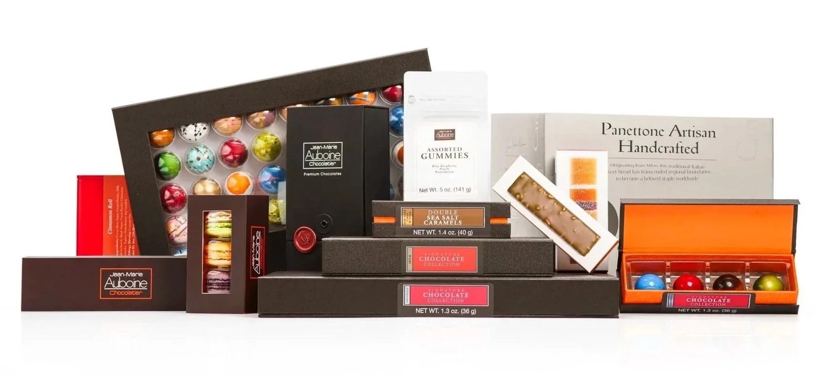 Corporate holiday gift options including chocolates, French macarons, confections, and panettone for clients, employees, and teams