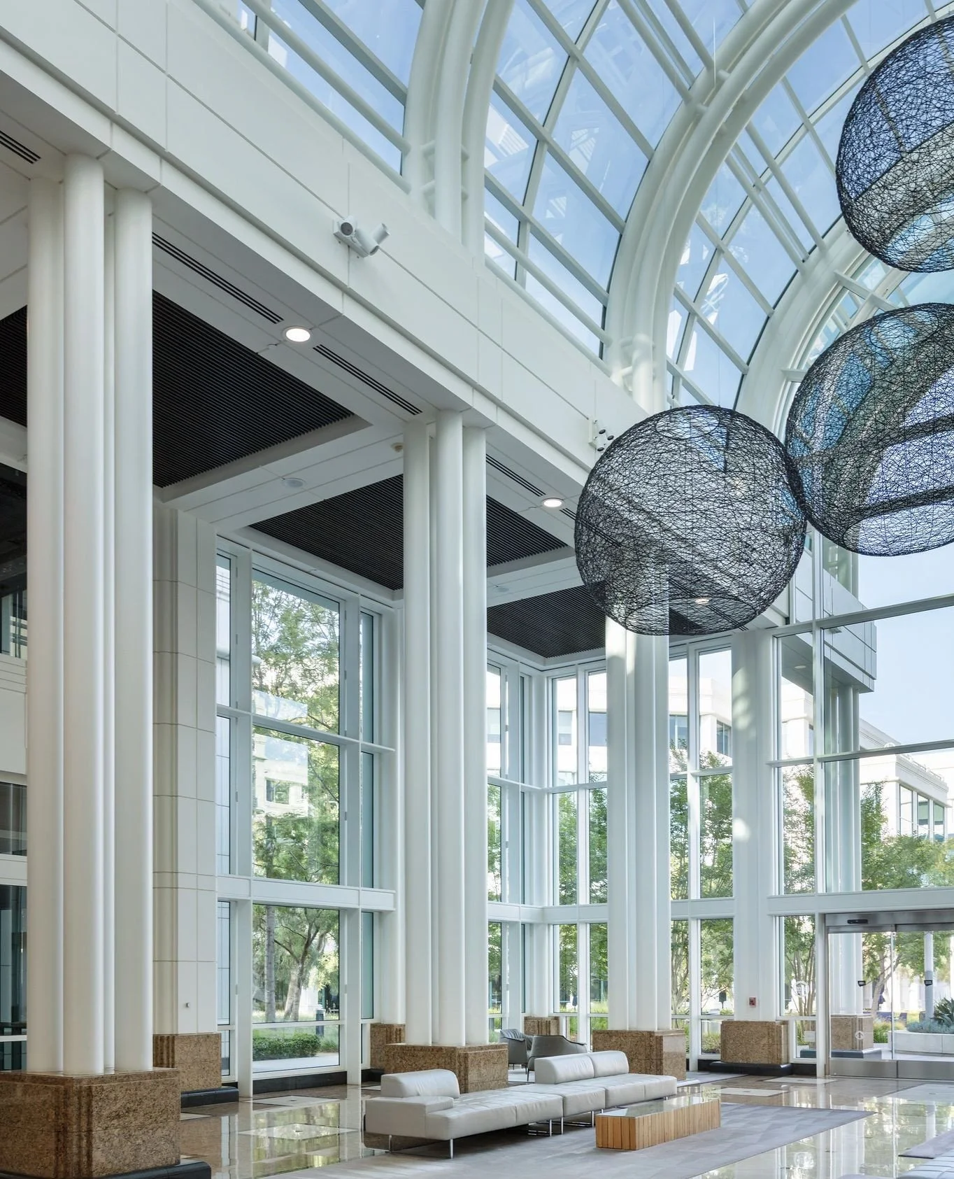 Soaring glass, soft light, and a front-row seat to the park. This is how we do "waiting areas" at the Water Garden.⁠
⁠
Pull up a chair and take a breath.⁠
⁠
#WaterGardenSantaMonica #LuxuryWorkspace #InteriorInspo #SiliconBeach #ModernOffice