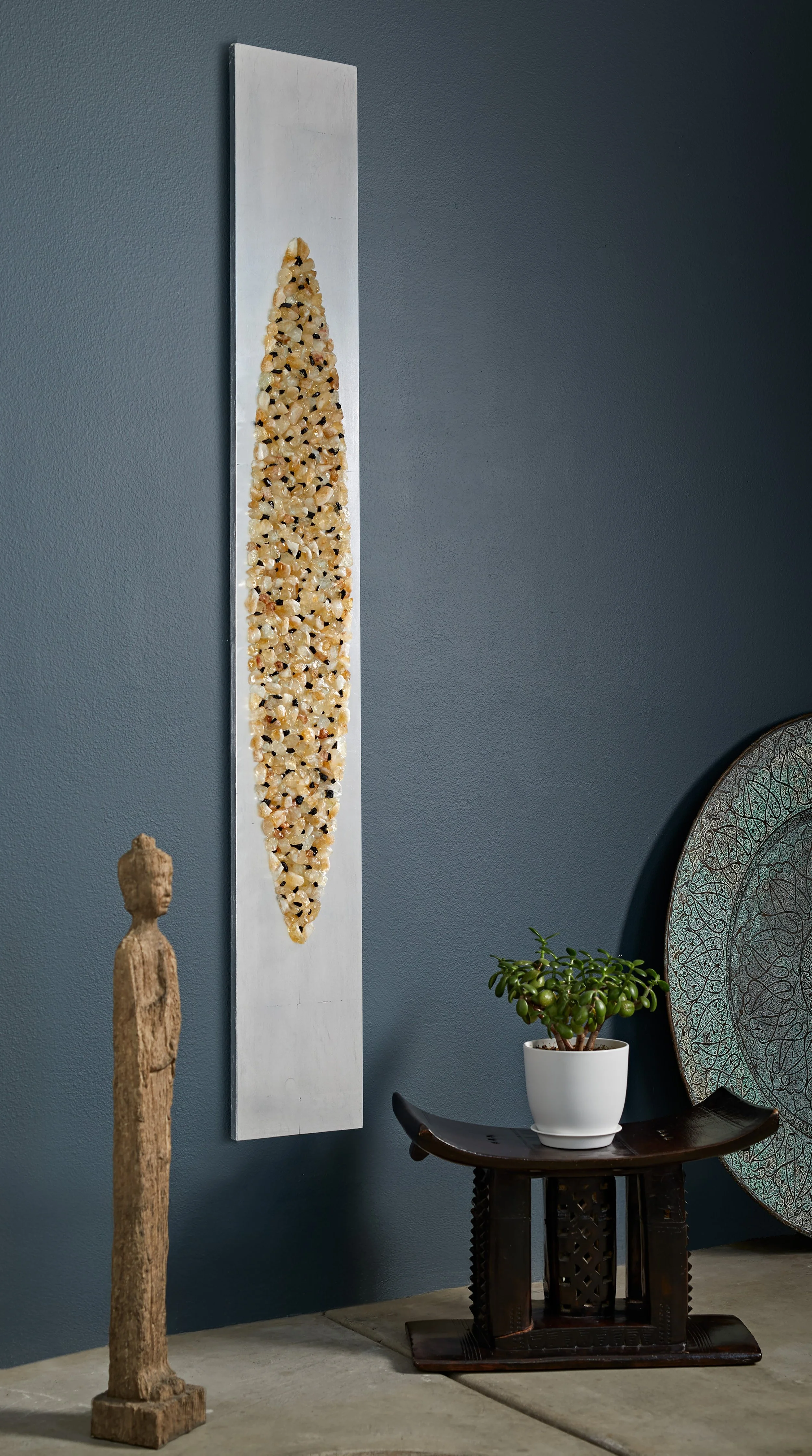 Mandorla wall sculpture installed vertically in a residential interior