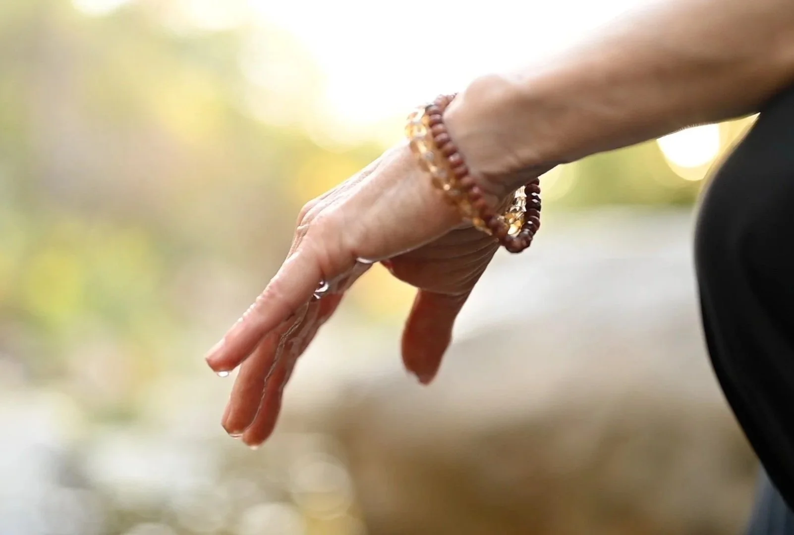 Nitya Sara’s hand outdoors in natural light
