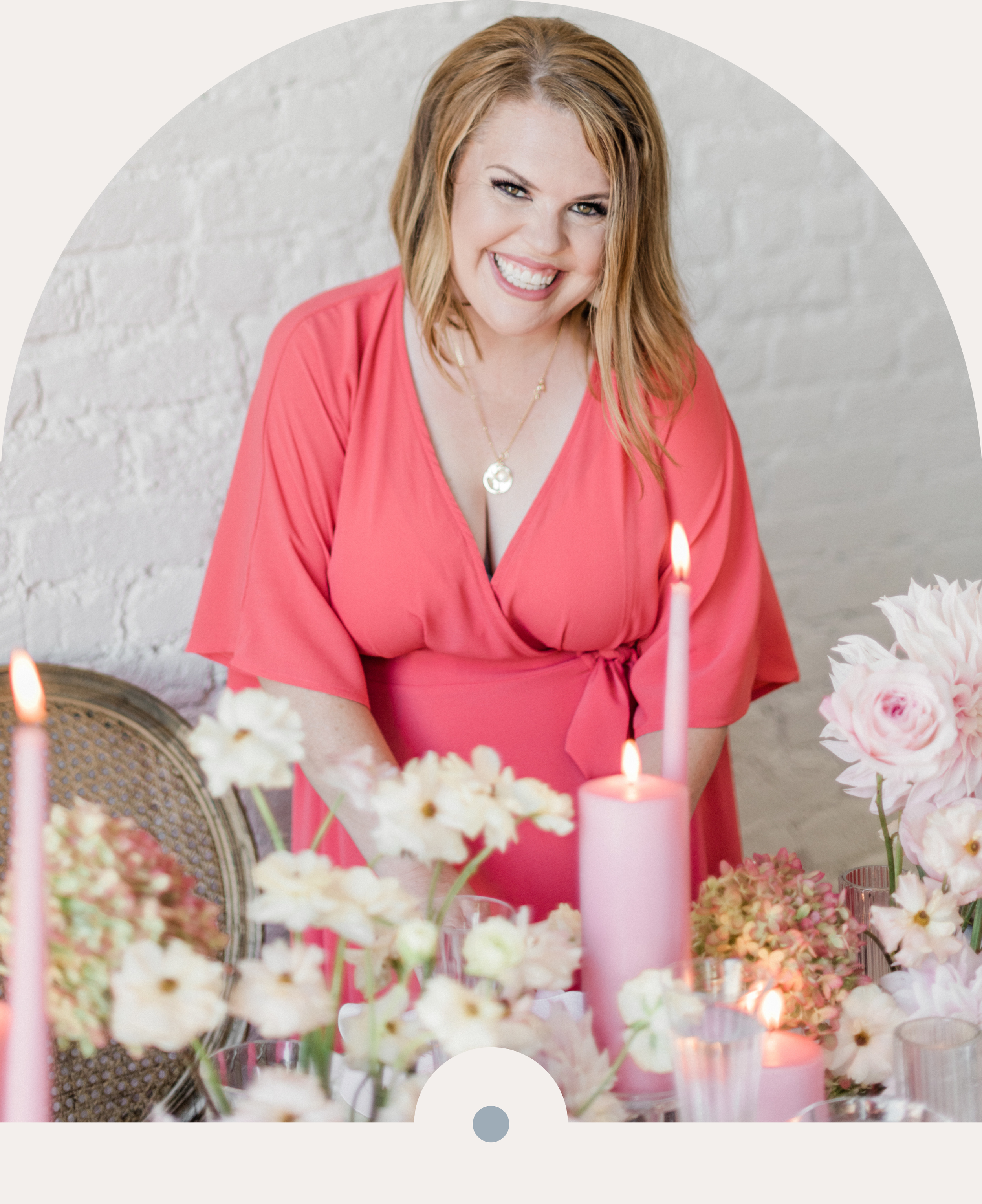 Wedding Pro Business Coach Lori Losee standing at a beautifully decorated pink inspired wedding tablescape.