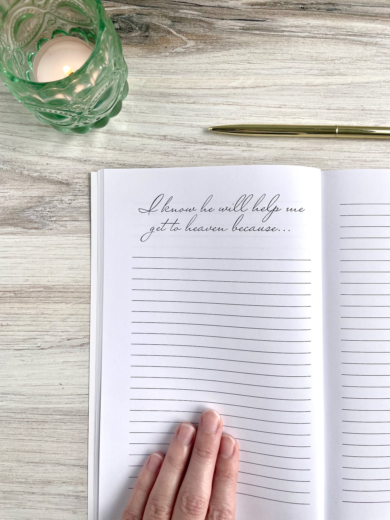 My Engagement Journal opened to a lined page for journaling. The header reads, "I know he will help me get to heaven because..." A green candle is visible.