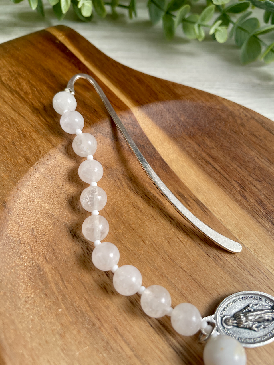 Gemstone bookmark with a decade's worth of rosary beads, miraculous medal, and small crucifix. White and gold Our Father bead.