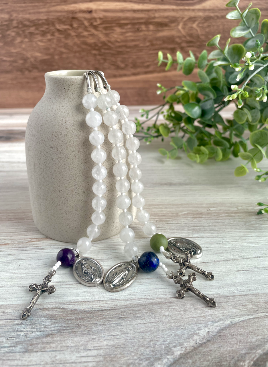 Trio of gemstone bookmarks with a decade's worth of rosary beads, miraculous medal, and small crucifix. Blue, red, and purple Our Father beads.
