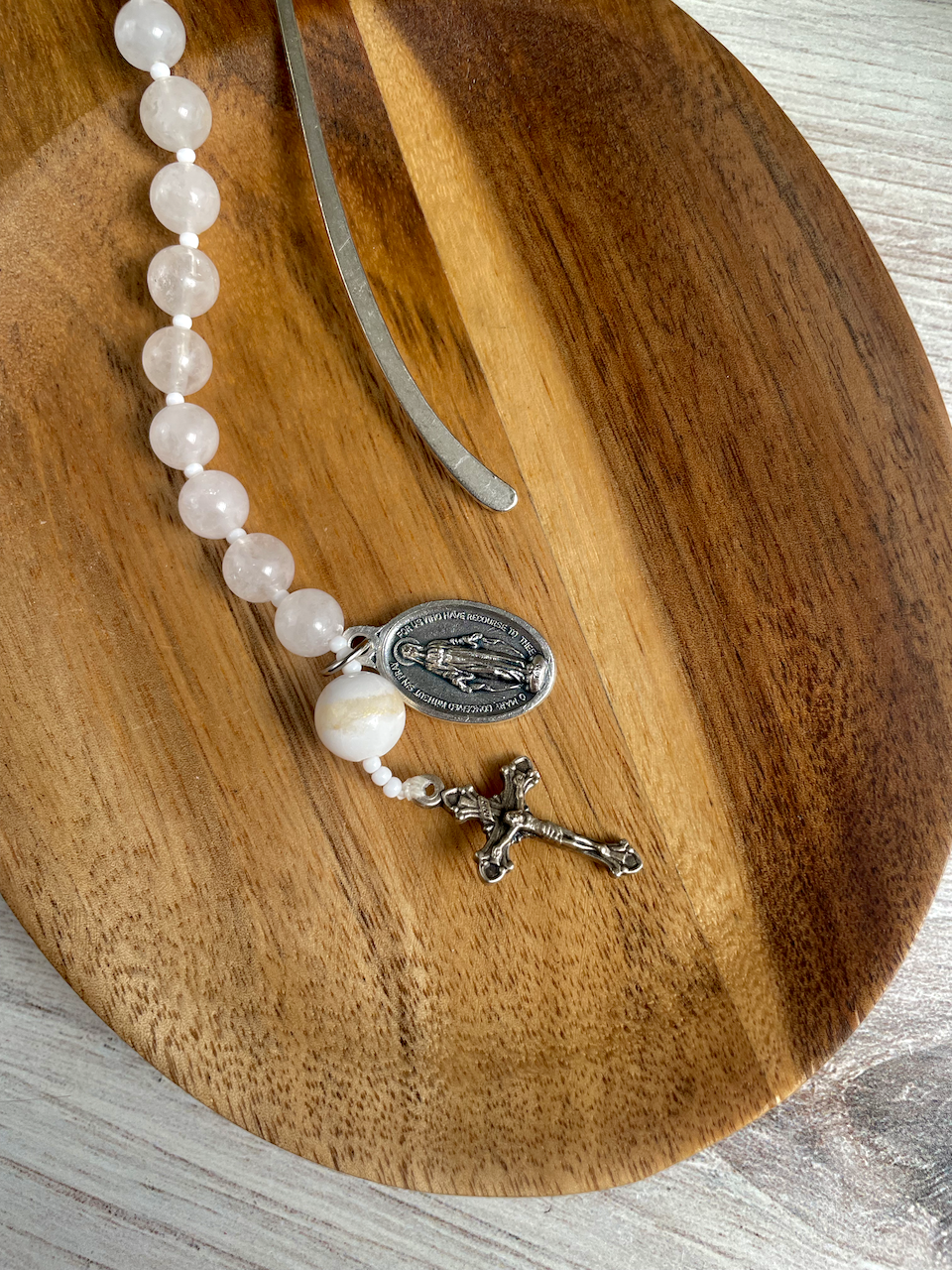 Gemstone bookmark with a decade's worth of rosary beads, miraculous medal, and small crucifix. White and gold Our Father bead.