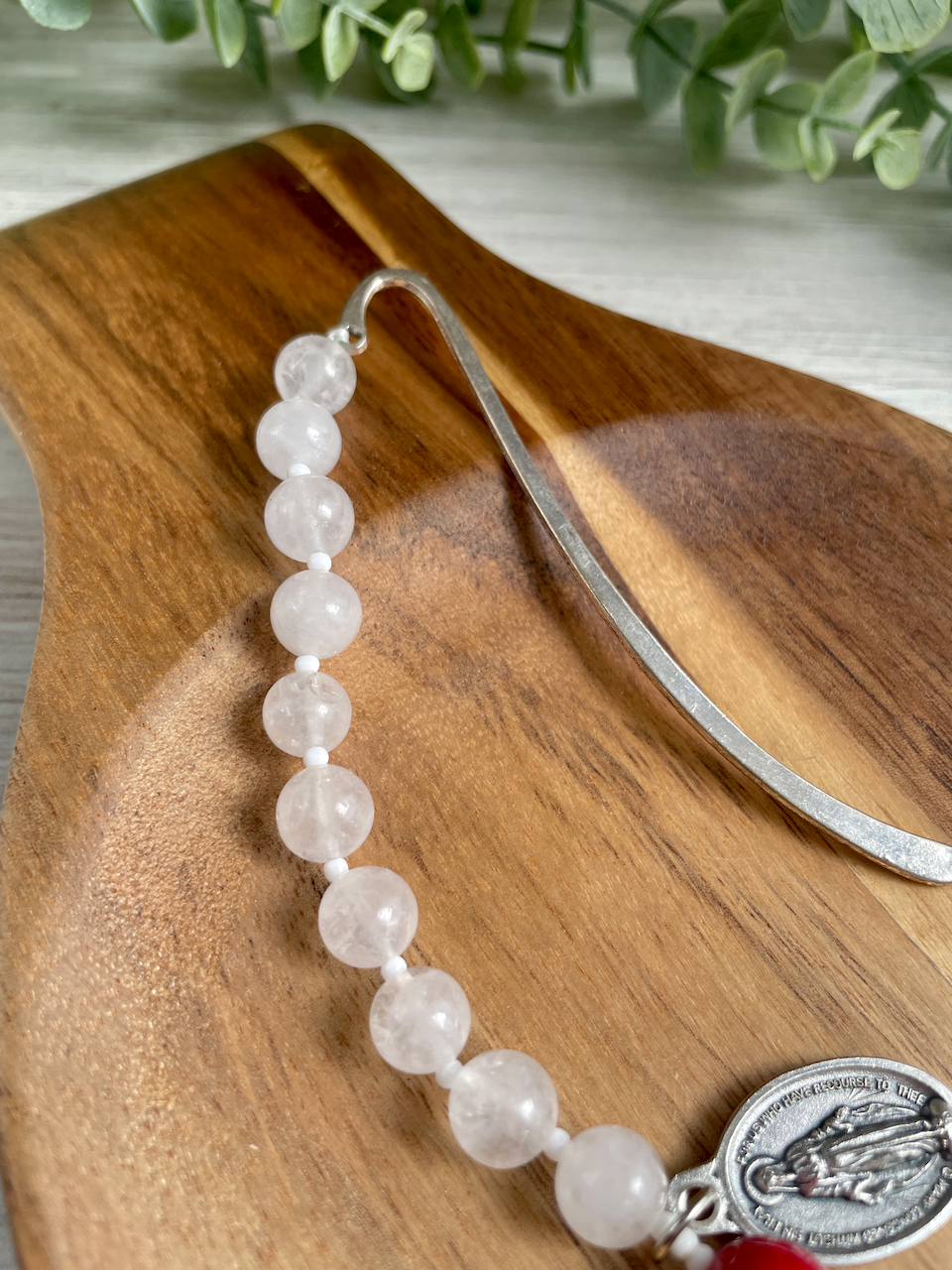 Gemstone bookmark with a decade's worth of rosary beads, miraculous medal, and small crucifix. Red Our Father bead.