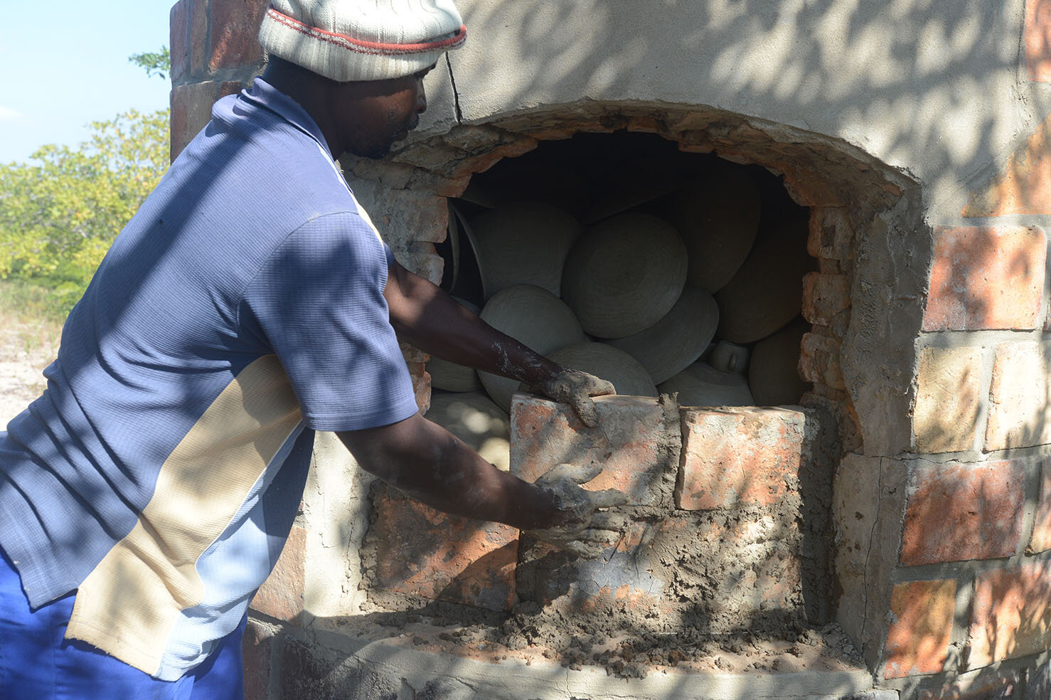 Loading the wooden kiln