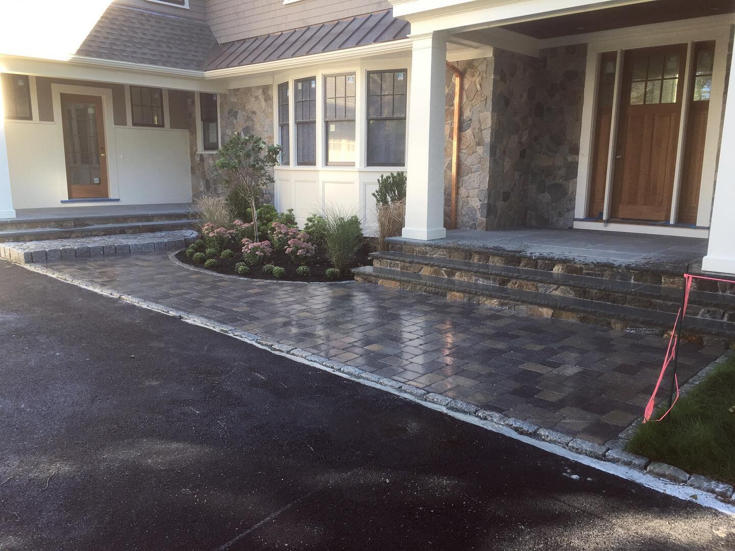 Looking to elevate your front entrance? Custom hardscape design is our specialty