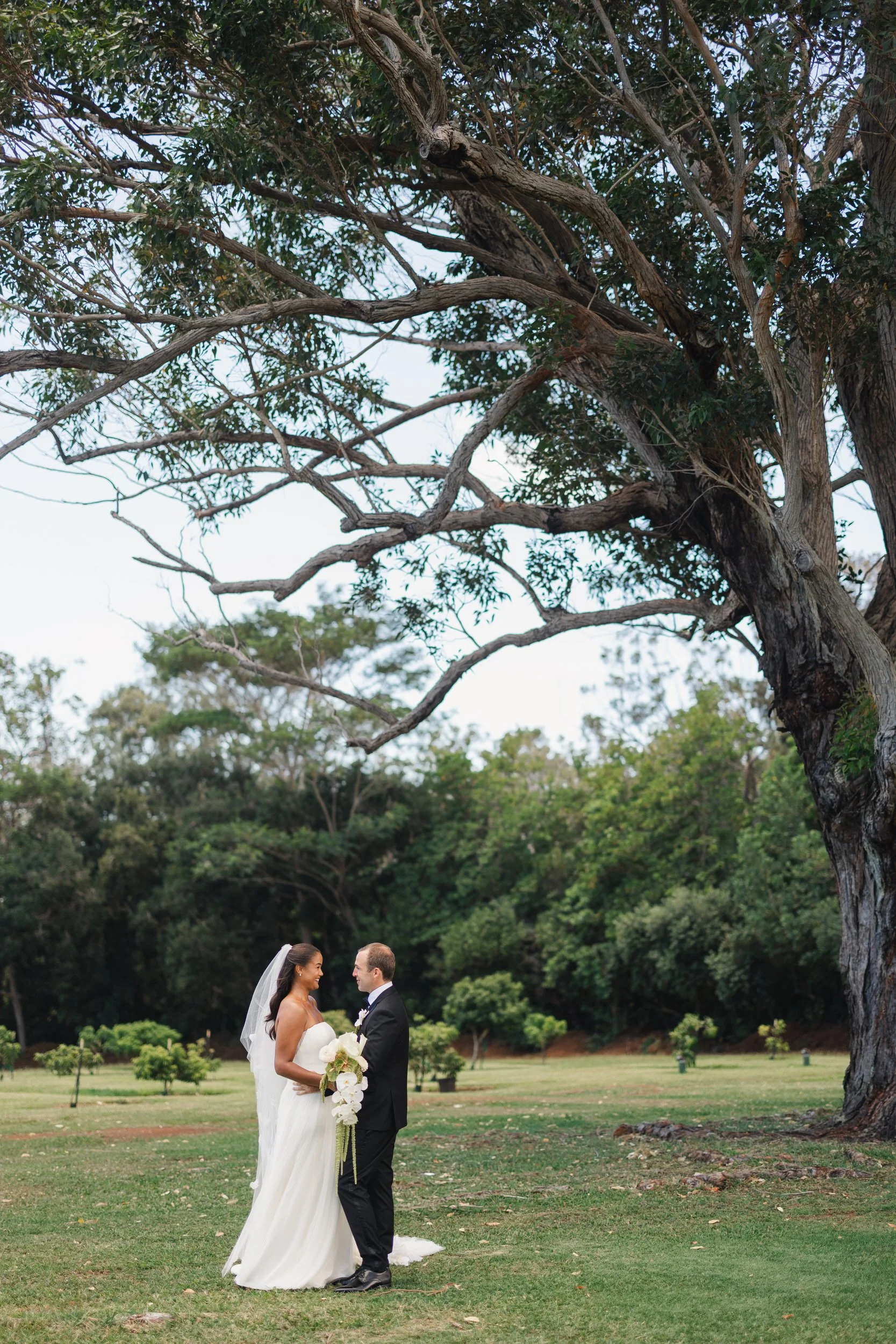 couple walking together during a sunset ranch hawaii wedding on oahu’s north shore