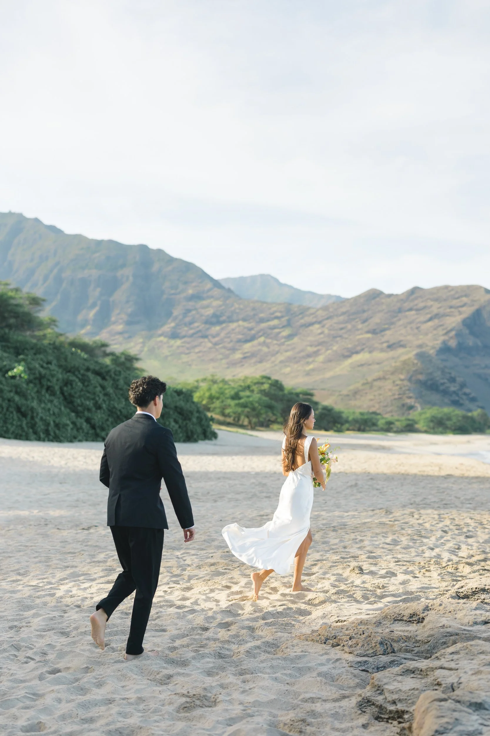 Couple portraits during sunrise beach elopement in Oahu