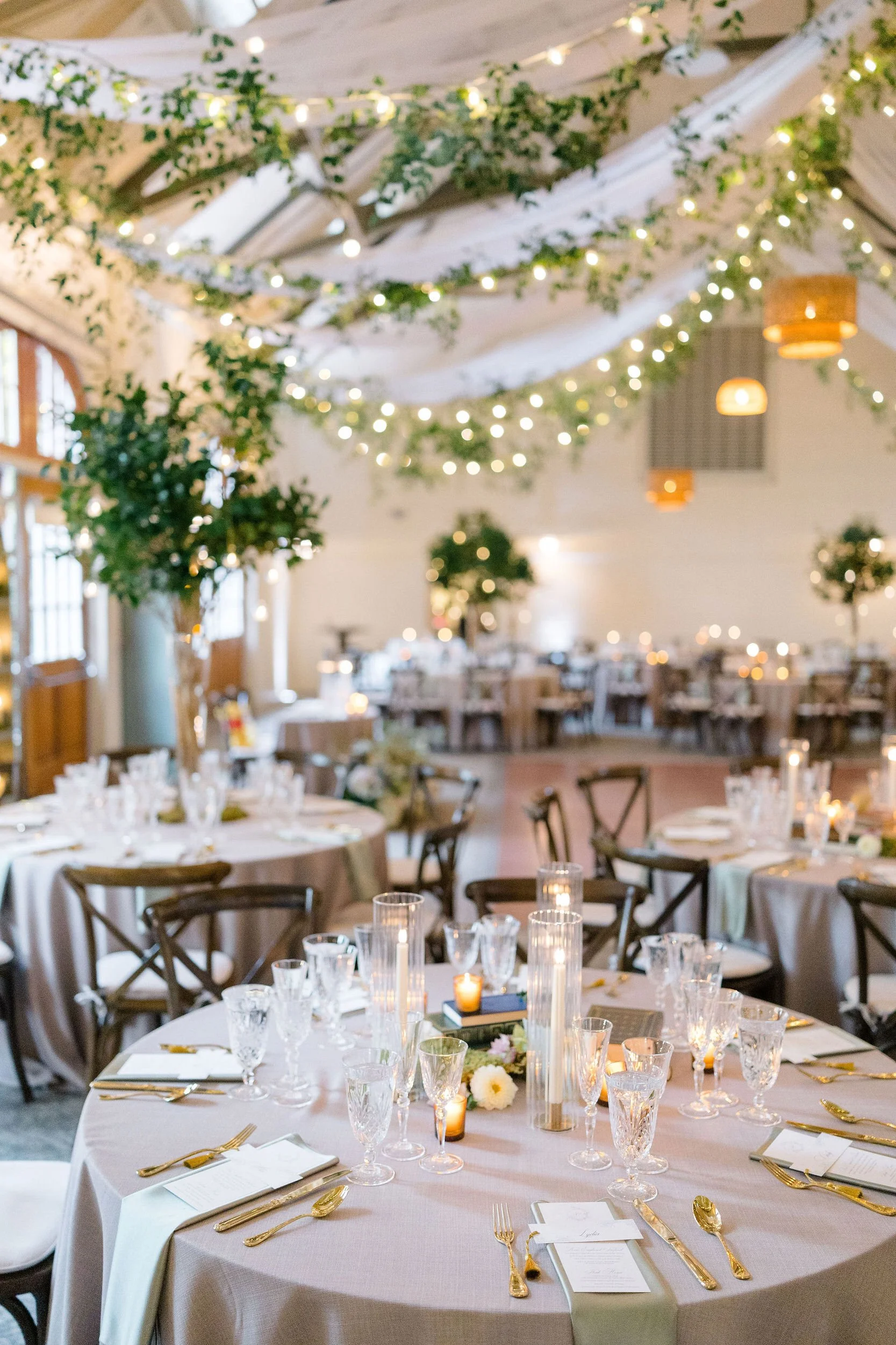 Reception tablescape featuring romantic details at a secret garden inspired wedding.