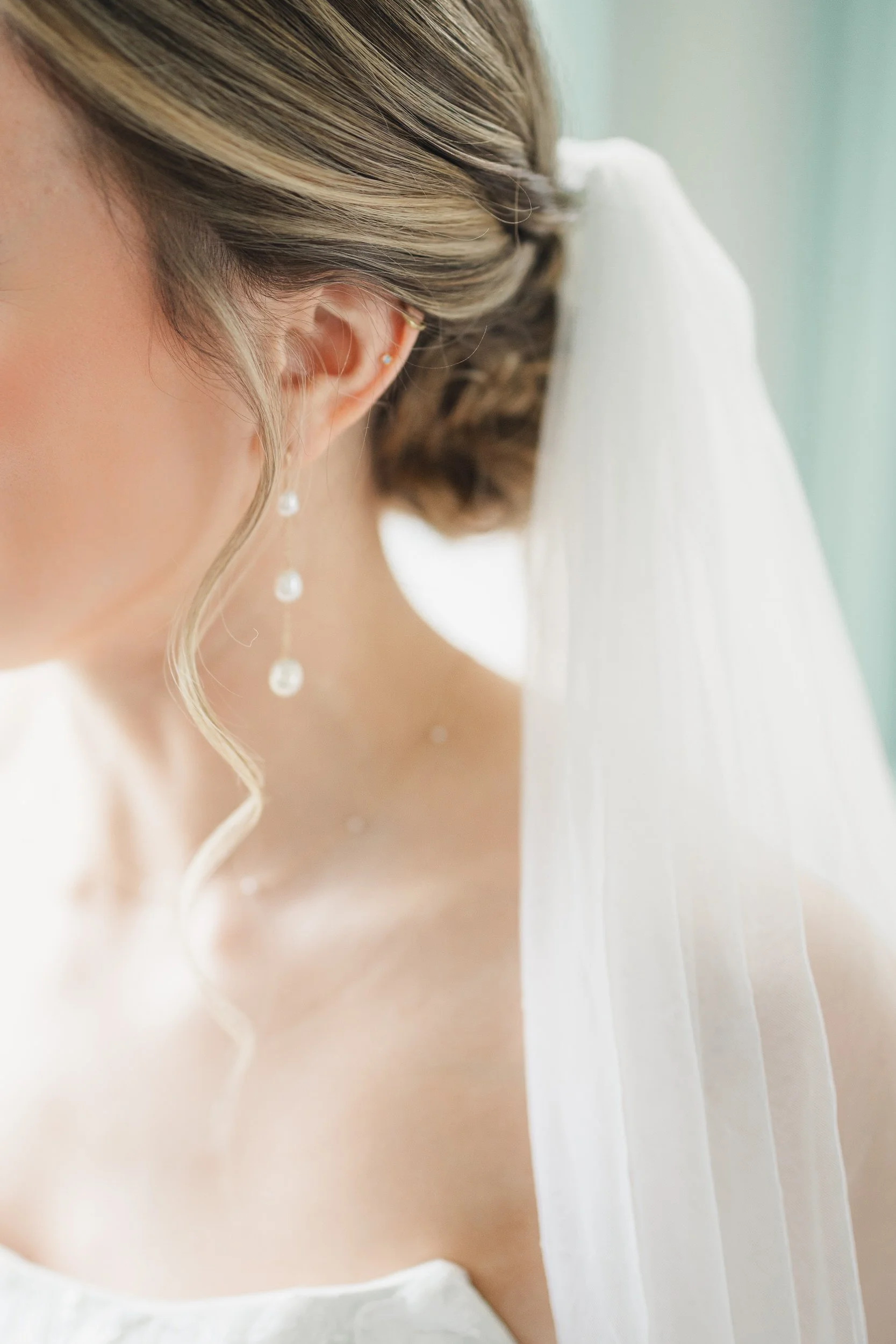 Bride preparing for wedding day in bright Massachusetts estate venue