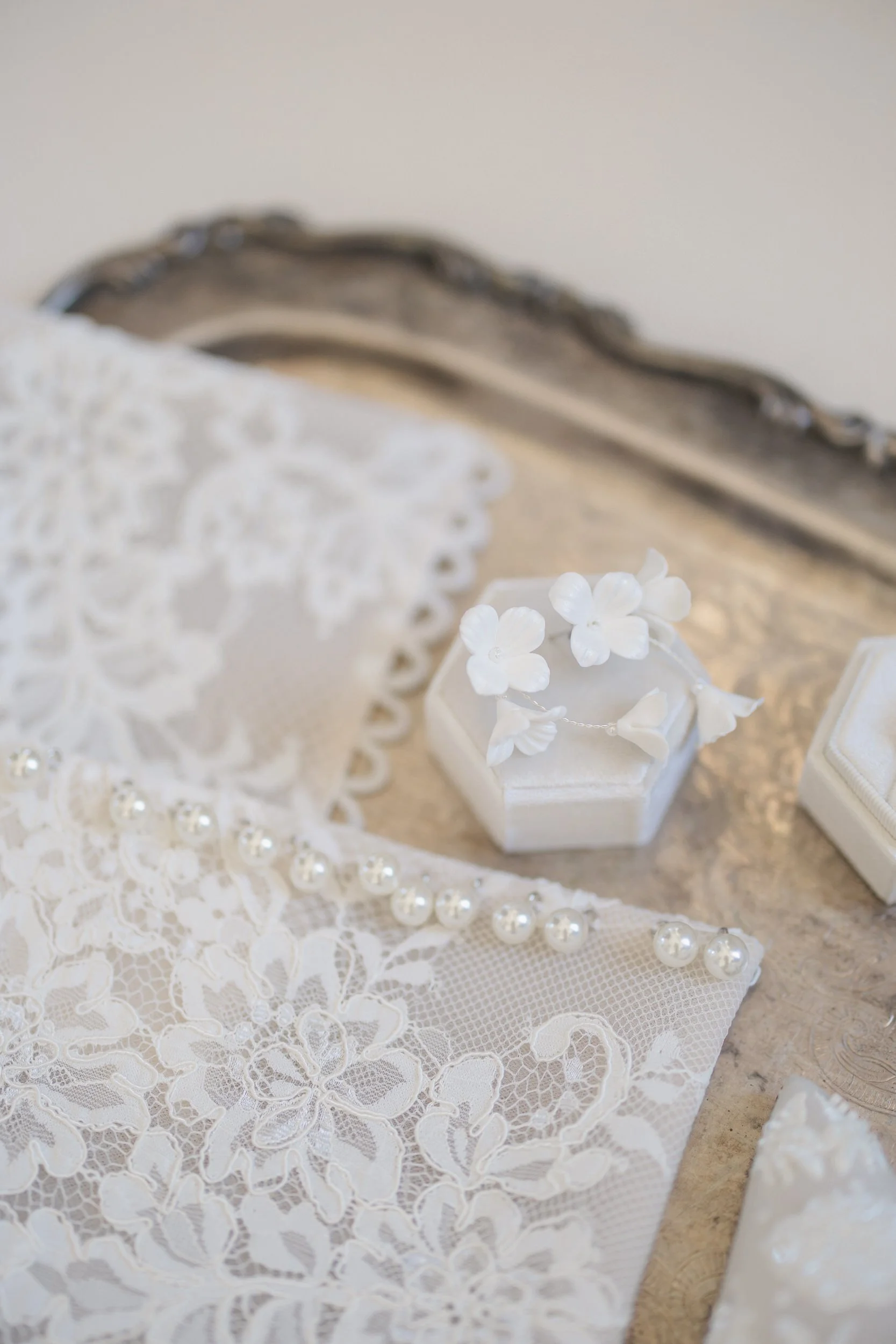 Chic bridal flat lay at a downtown Charleston wedding photographed at Brasserie La Banque
