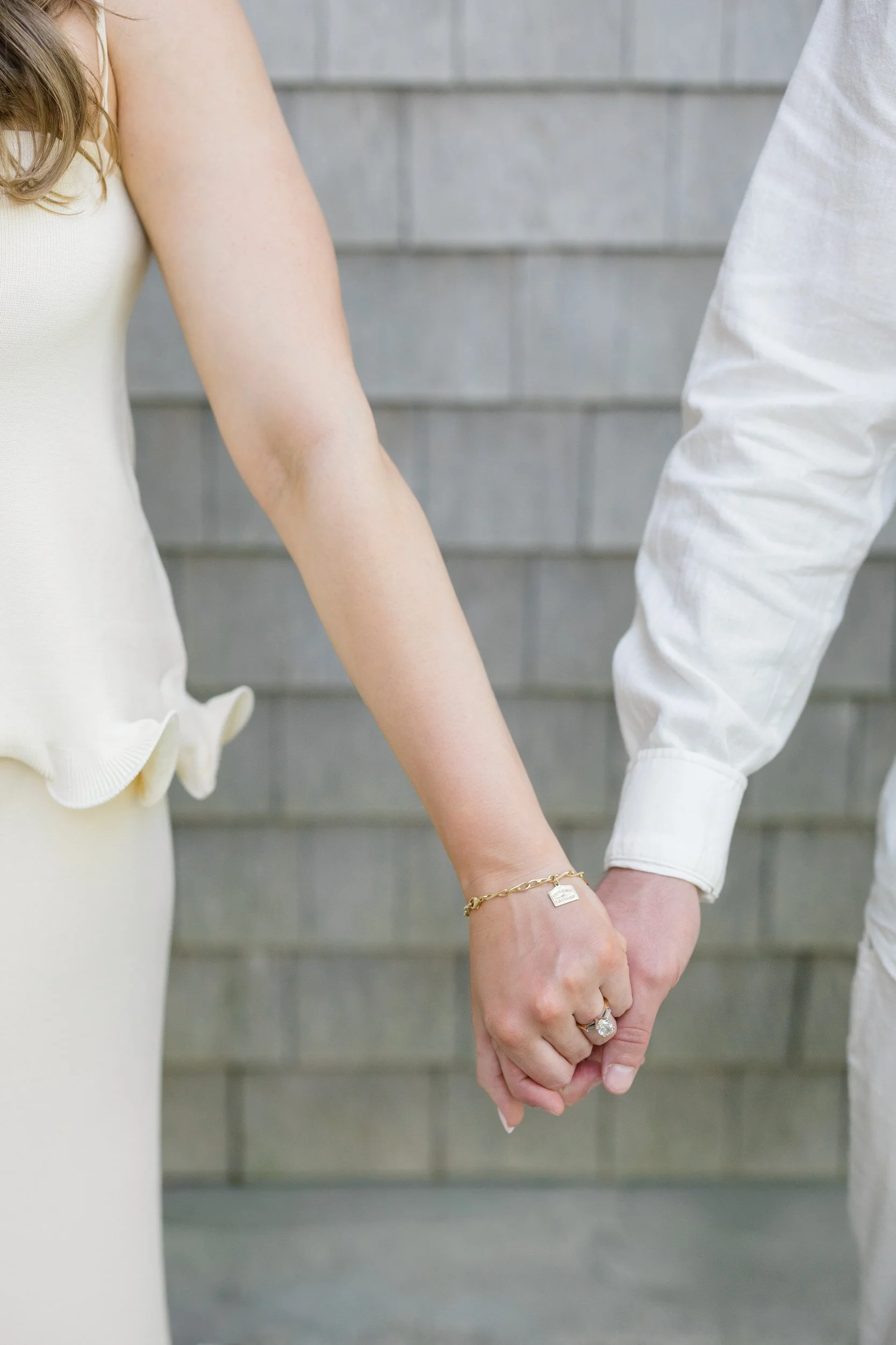 Romantic Cape Cod engagement session at a coastal cottage in Chatham featuring relaxed, elevated coastal chic styling.