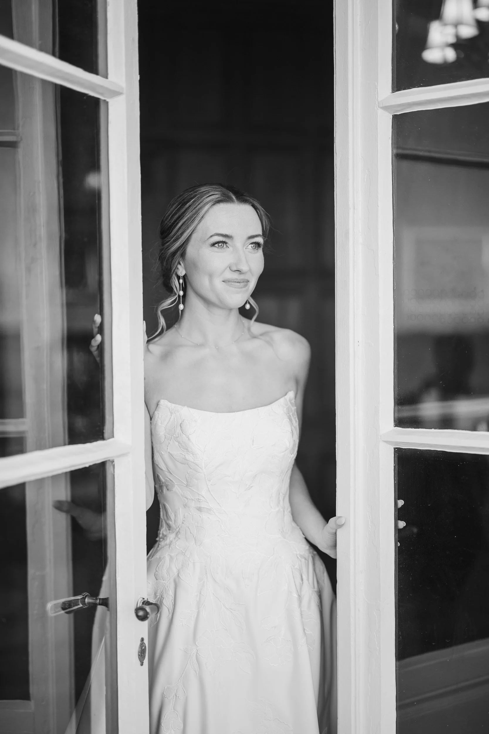 Bride in modern wedding gown photographed inside historic coastal estate