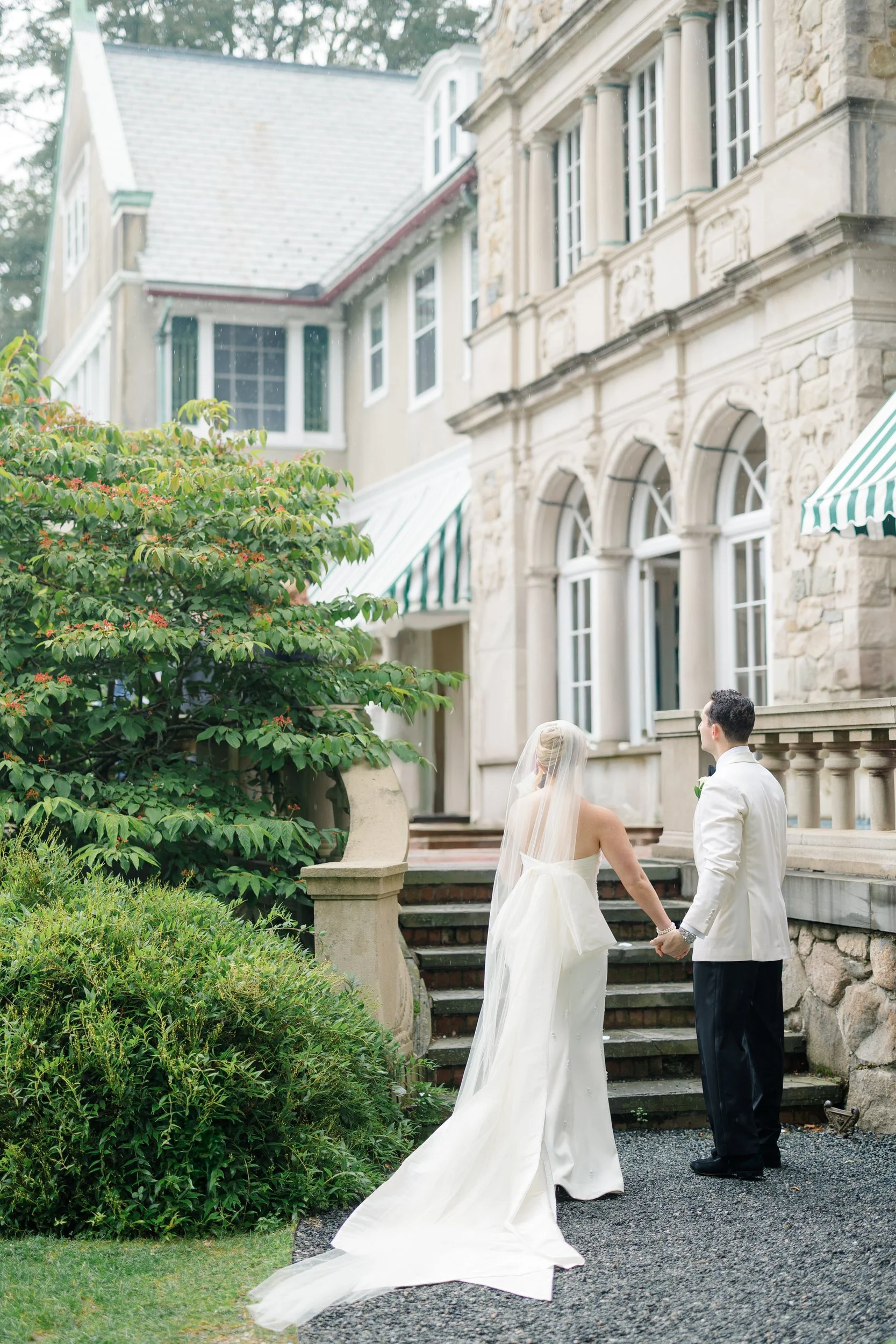 Golden hour portraits of the bride and groom at Blithewold Mansion & Gardens.