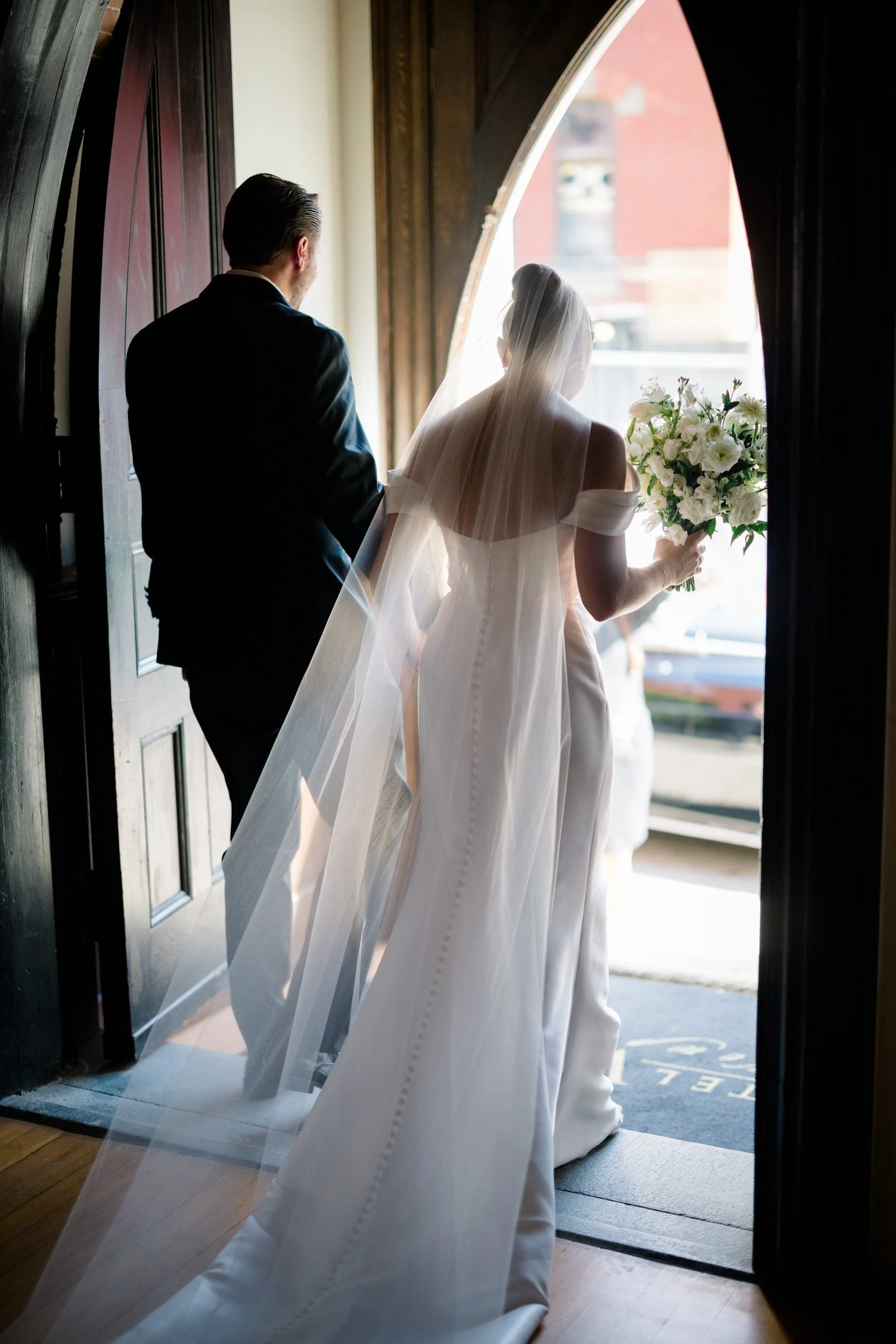 Documentary wedding ceremony coverage by a Rosecliff wedding photographer