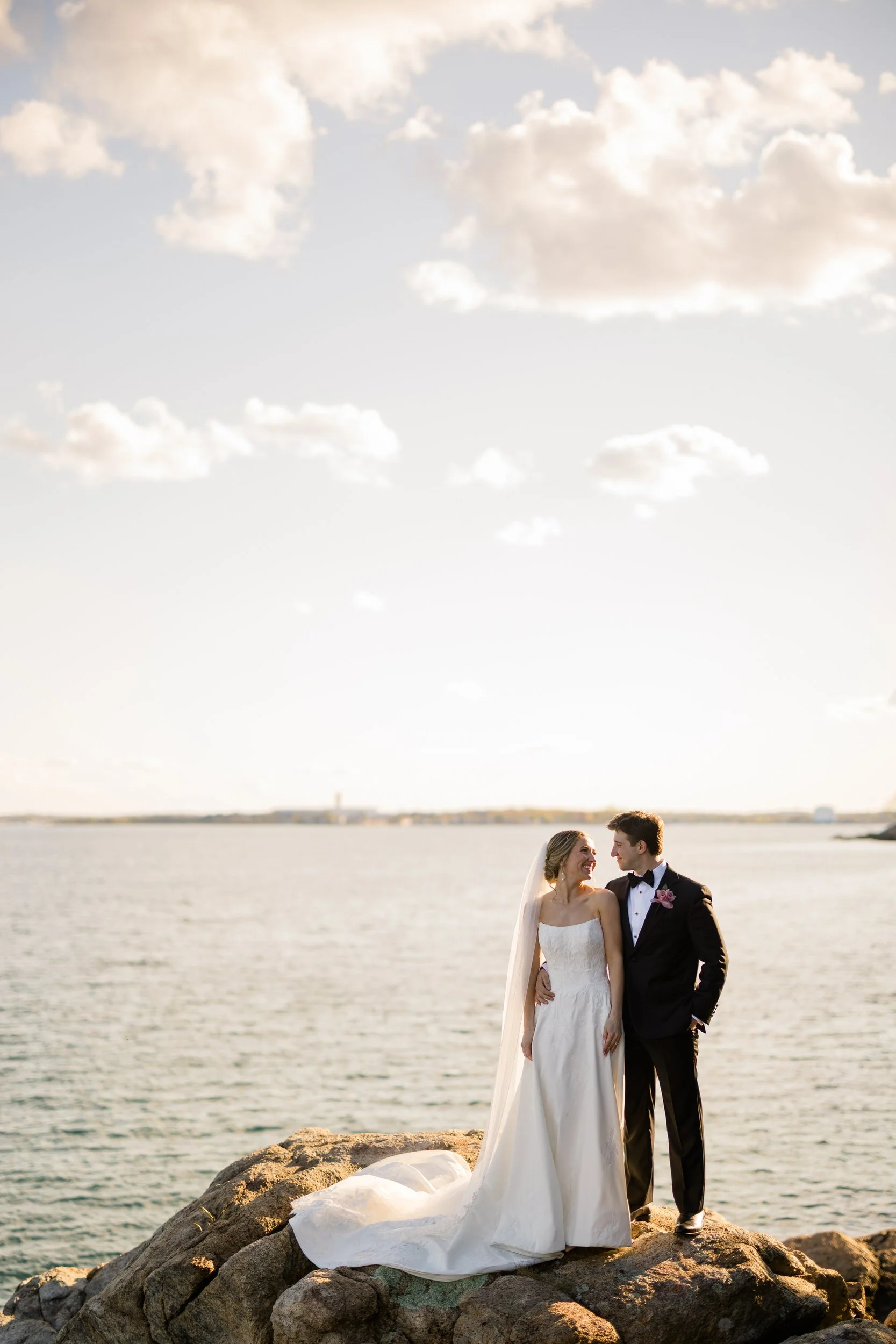 Sunset wedding portraits on the coastal rocks at Misselwood Estate