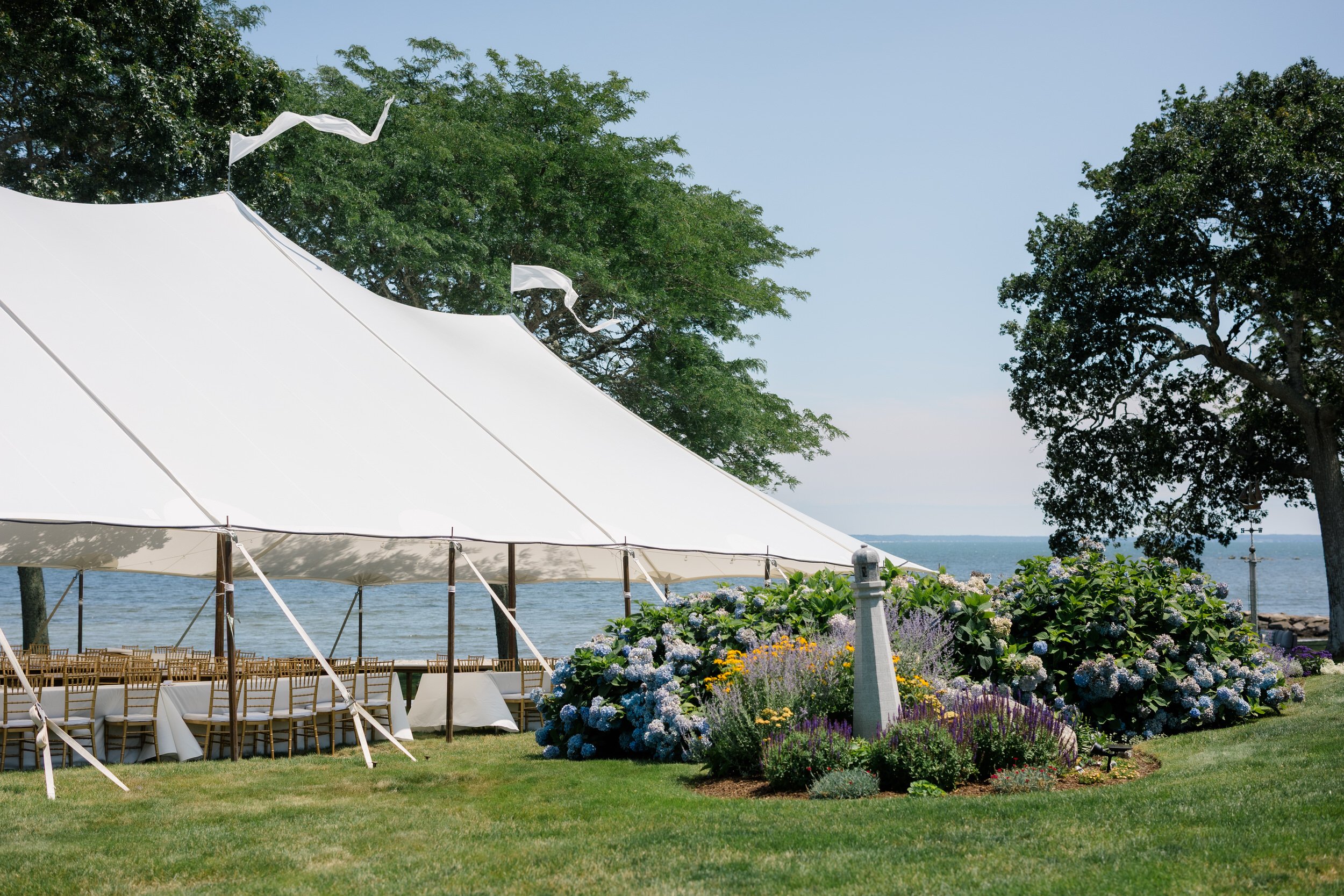 Elegant reception décor with rentals from Chase Canopy at a Cape Cod private estate wedding.