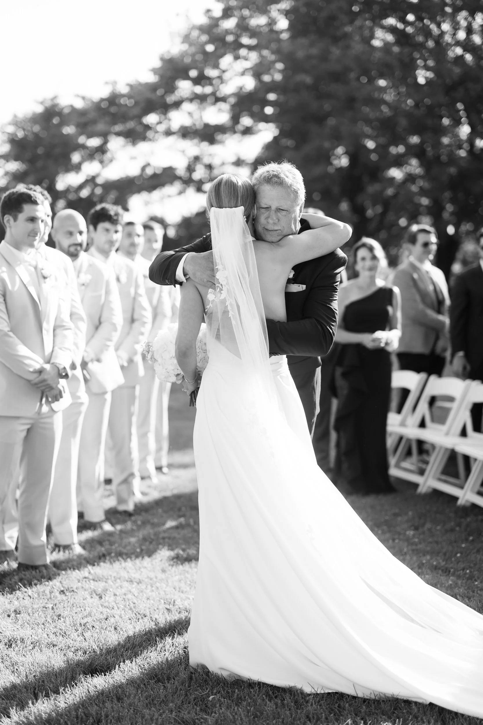 Summer wedding ceremony overlooking the ocean in Beverly, Massachusetts.