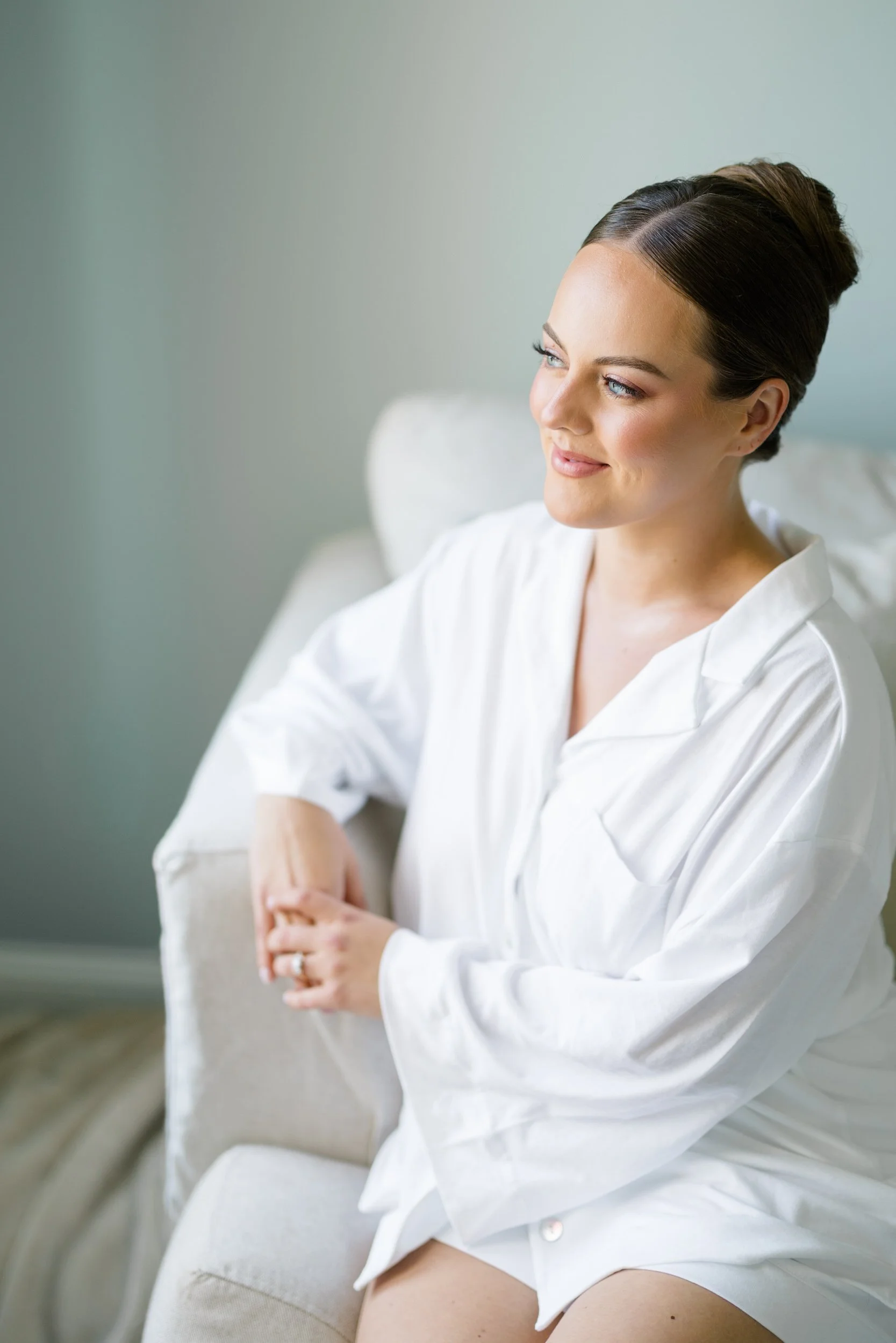 Bride getting ready with her family at her parents' Cape Cod home before her private estate wedding.