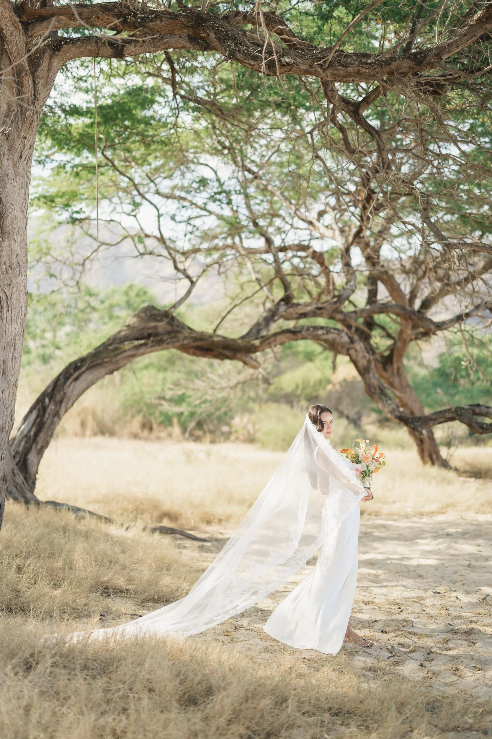 Bridal portrait during sunrise beach elopement in Oahu