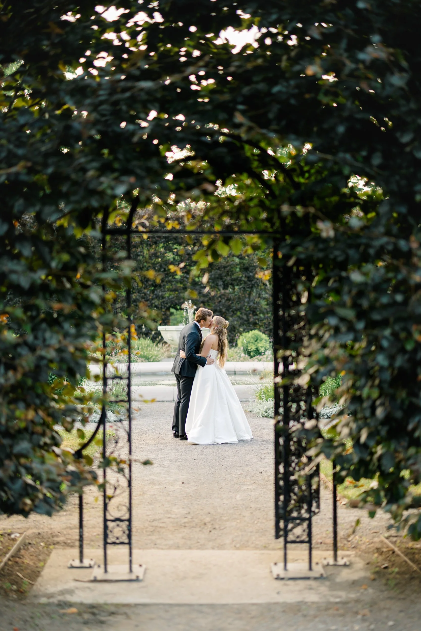 Elegant bride and groom portraits surrounded by Elm Bank gardens