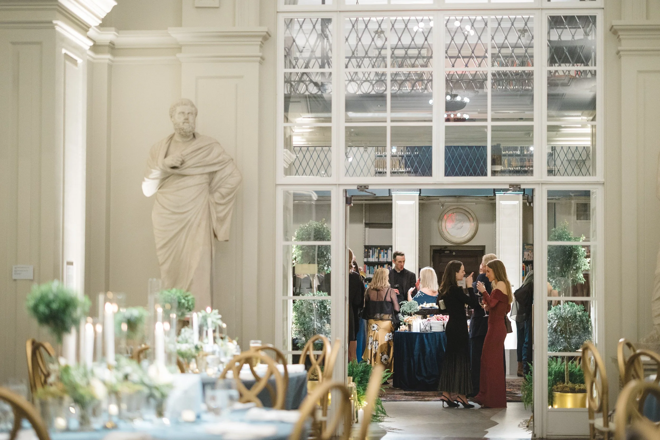 Evening welcome party inside the historic Boston Athenaeum.