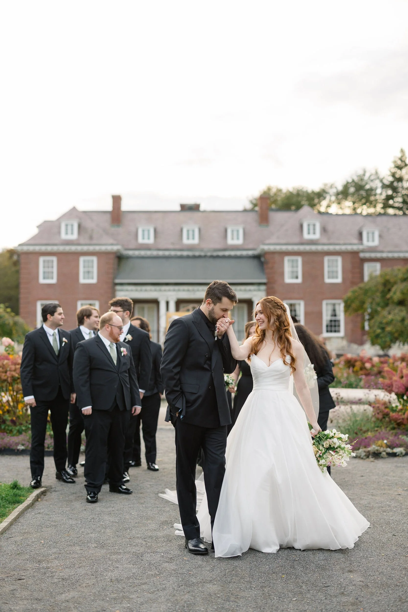 Wedding party celebrating together at an autumn wedding at Elm Bank Gardens.
