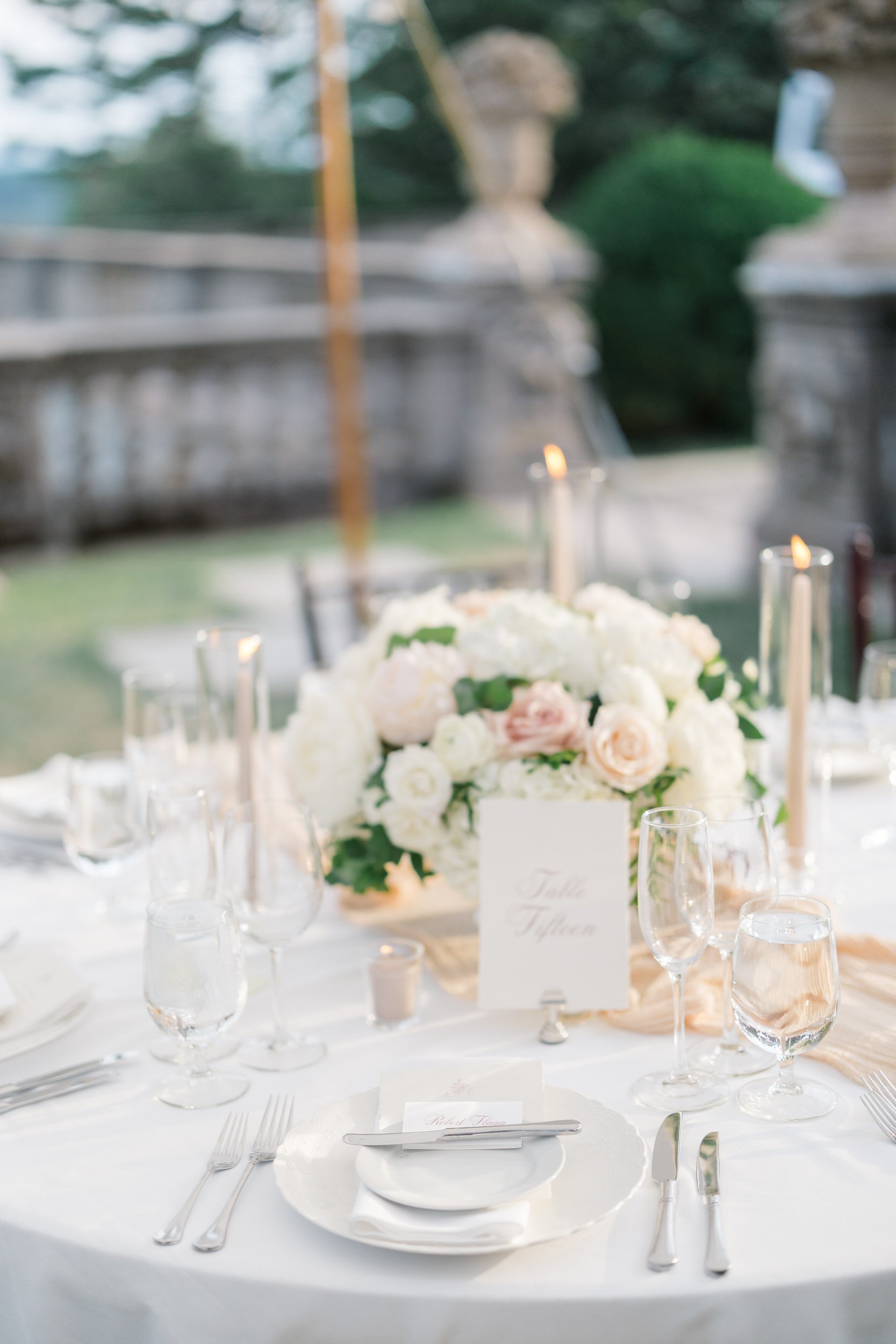 Luxury reception details styled beneath the tent at Castle Hill on the Crane Estate.