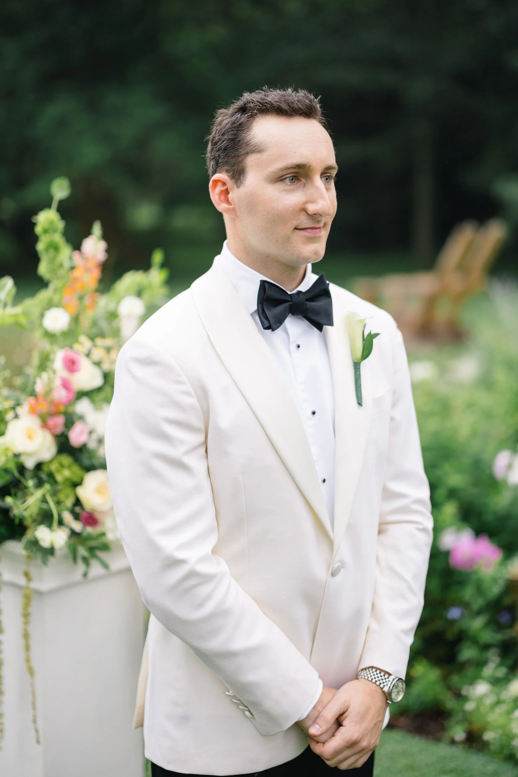 Documentary photograph of a garden wedding ceremony at Blithewold Mansion.