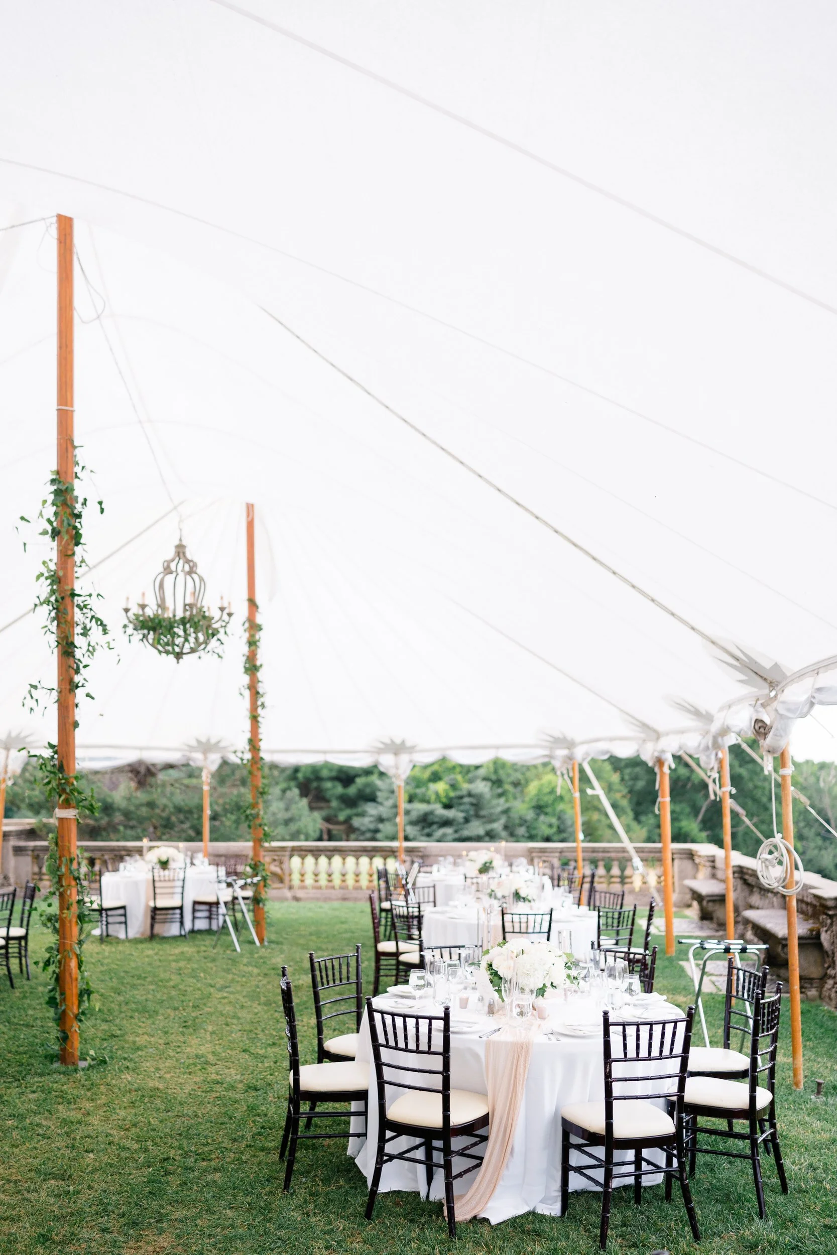 Romantic tablescape featuring candlelight and florals for a Crane Estate wedding reception.