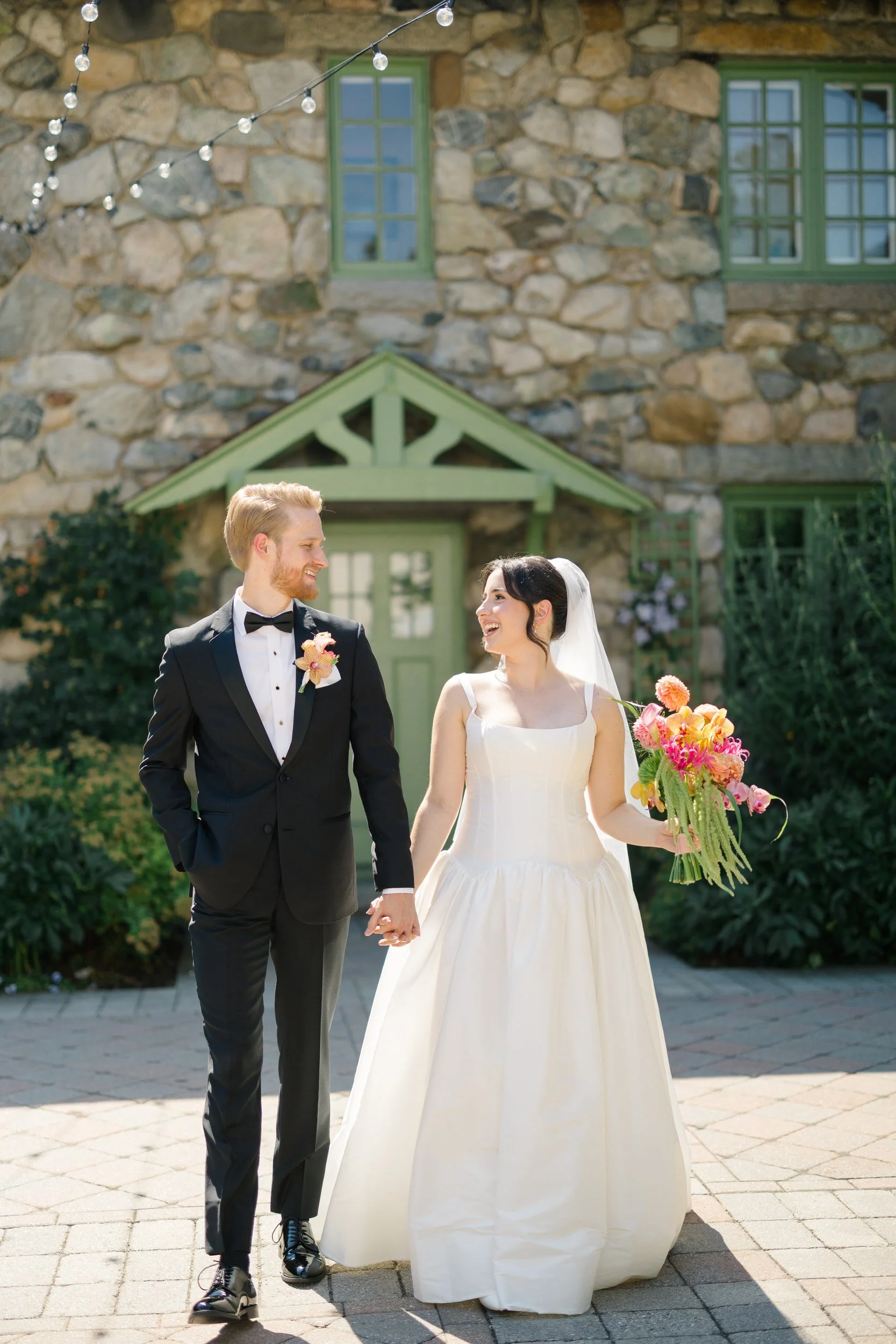 Bride and groom portraits in estate gardens during Massachusetts summer wedding at Willowdale Estate