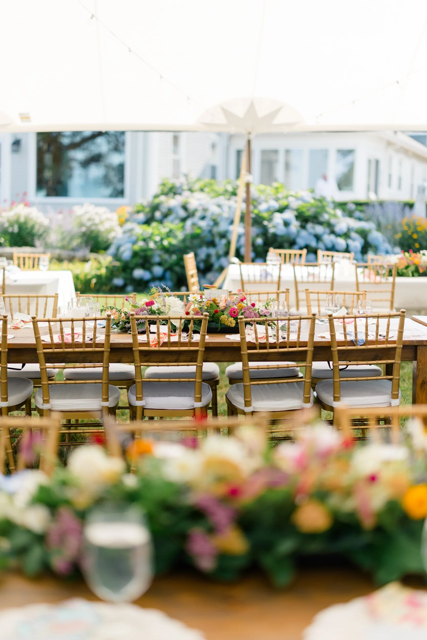 Reception design featuring coastal-inspired florals and candlelight.