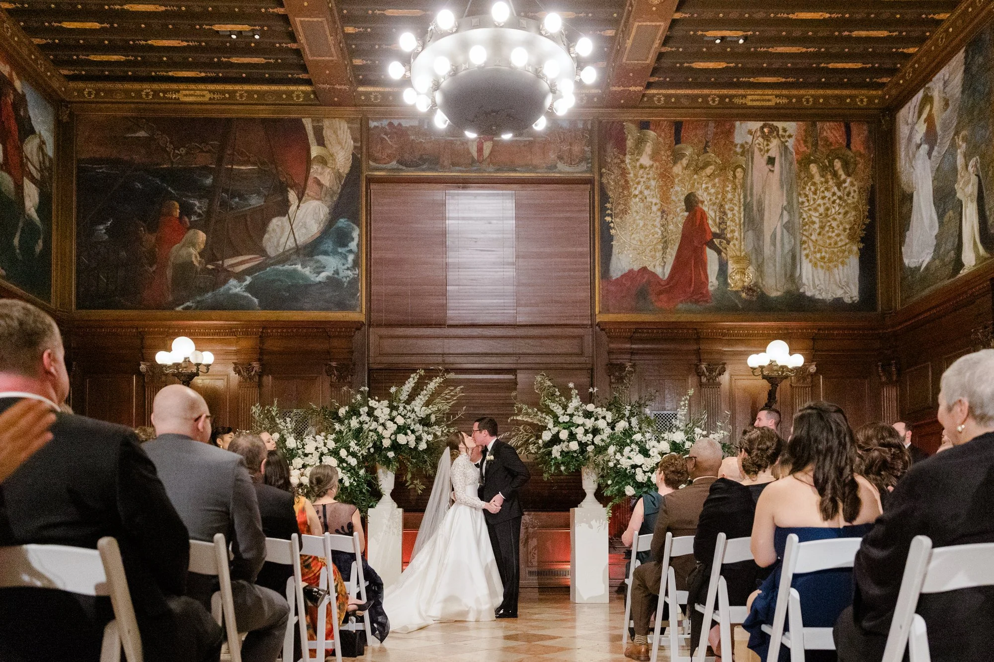 Bride and groom share their first kiss at Boston Public Library Wedding