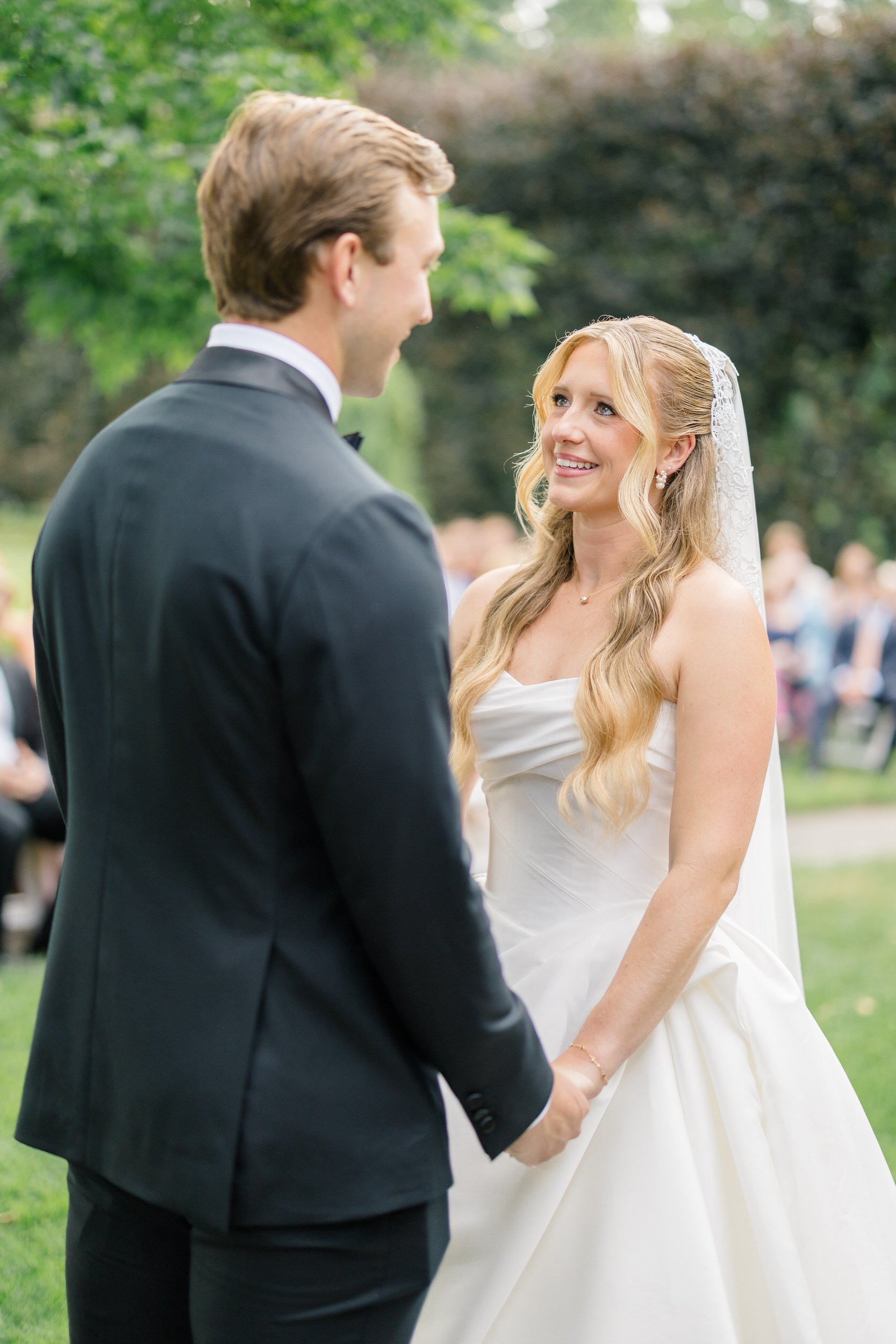 Bride and groom exchanging vows at The Gardens at Elm Bank