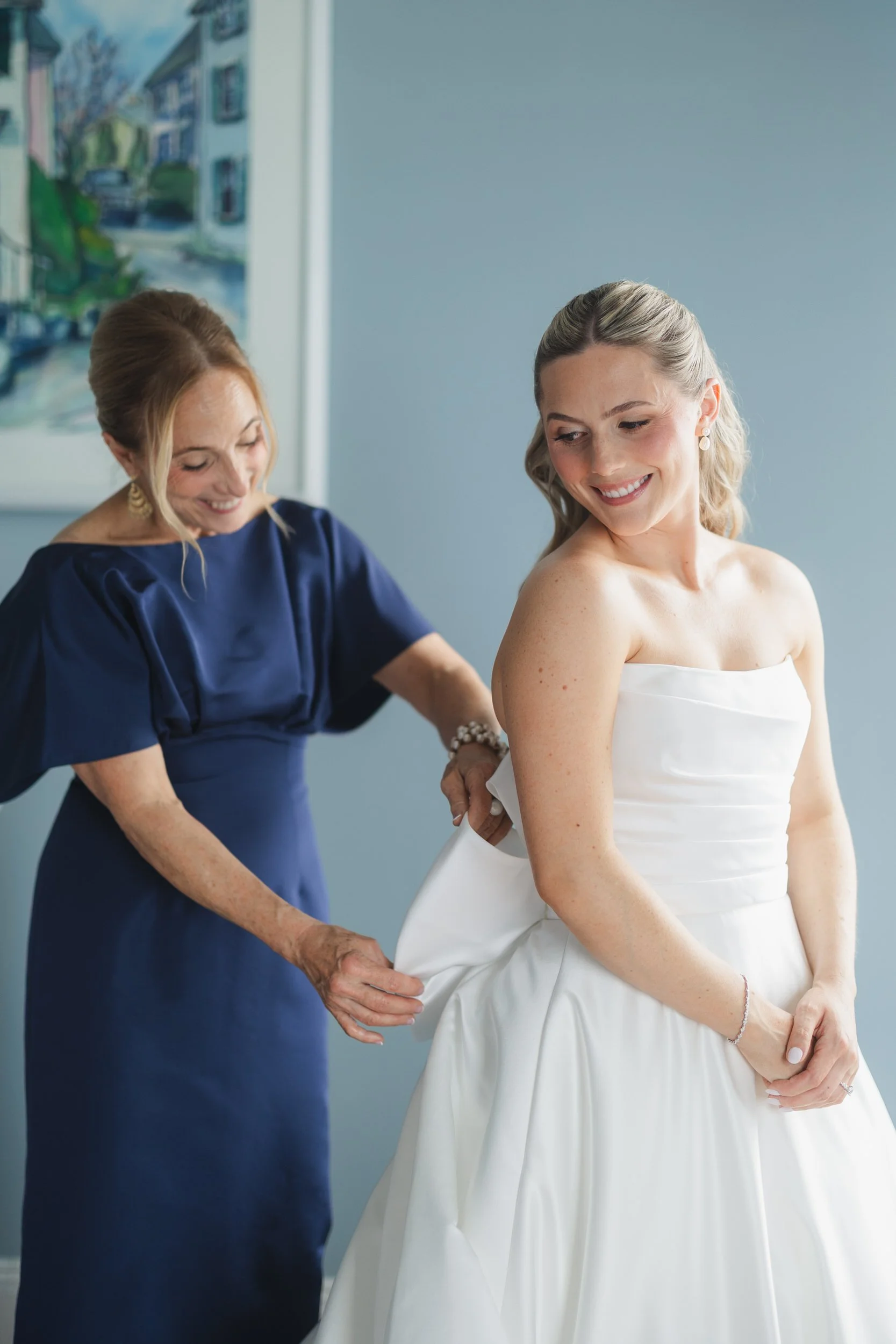 The bride prepares for her wedding day at Corinthian Yacht Club with coastal New England views nearby.