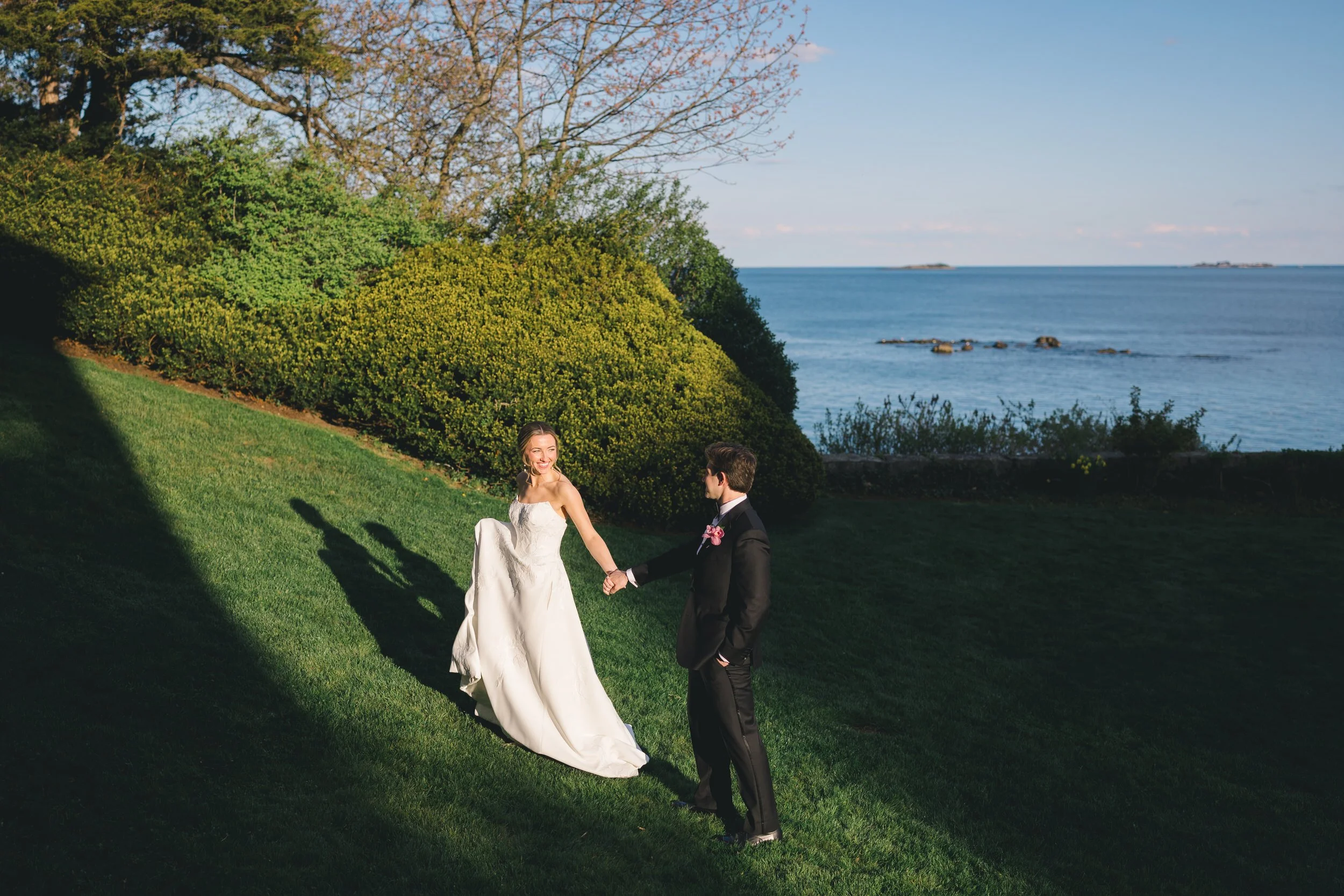 Romantic sunset wedding portraits on the waterfront rocks at Misselwood Estate