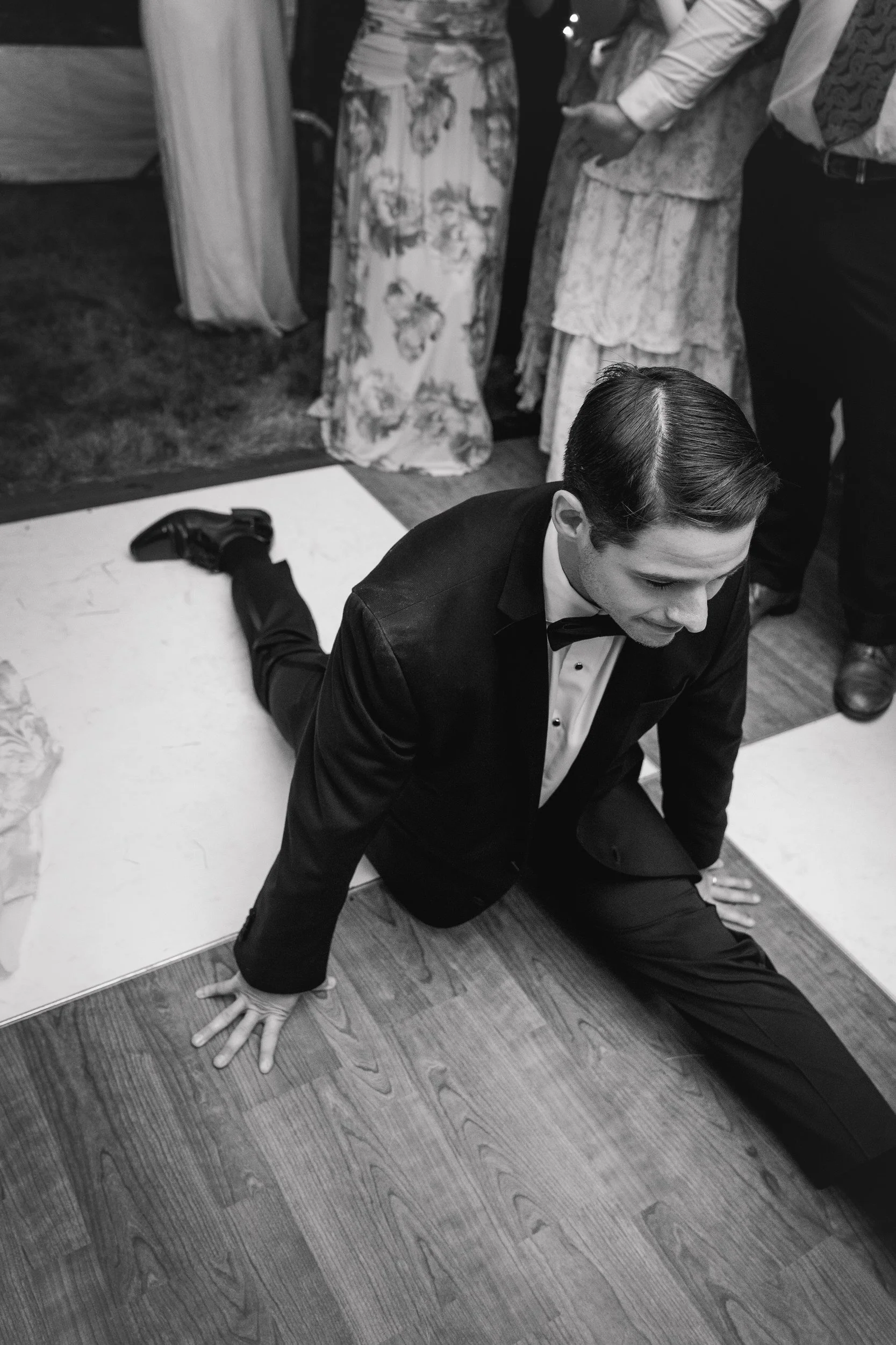Wedding guests dancing under a tent at a Cape Cod estate.