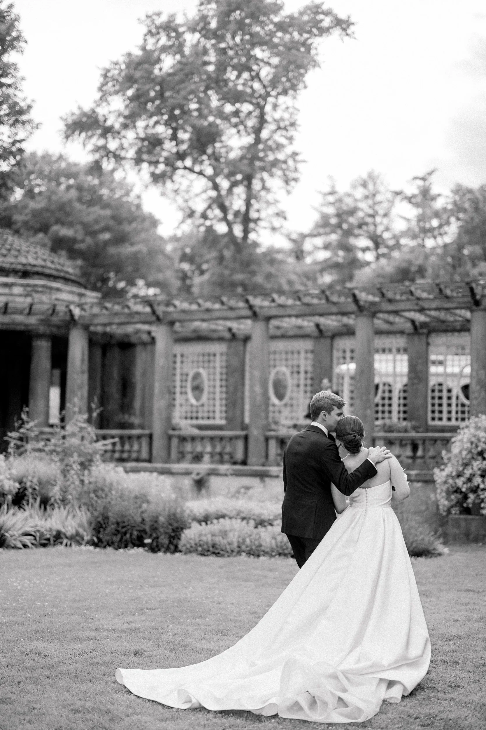 Romantic garden wedding ceremony at Castle Hill on the Crane Estate in soft natural light.